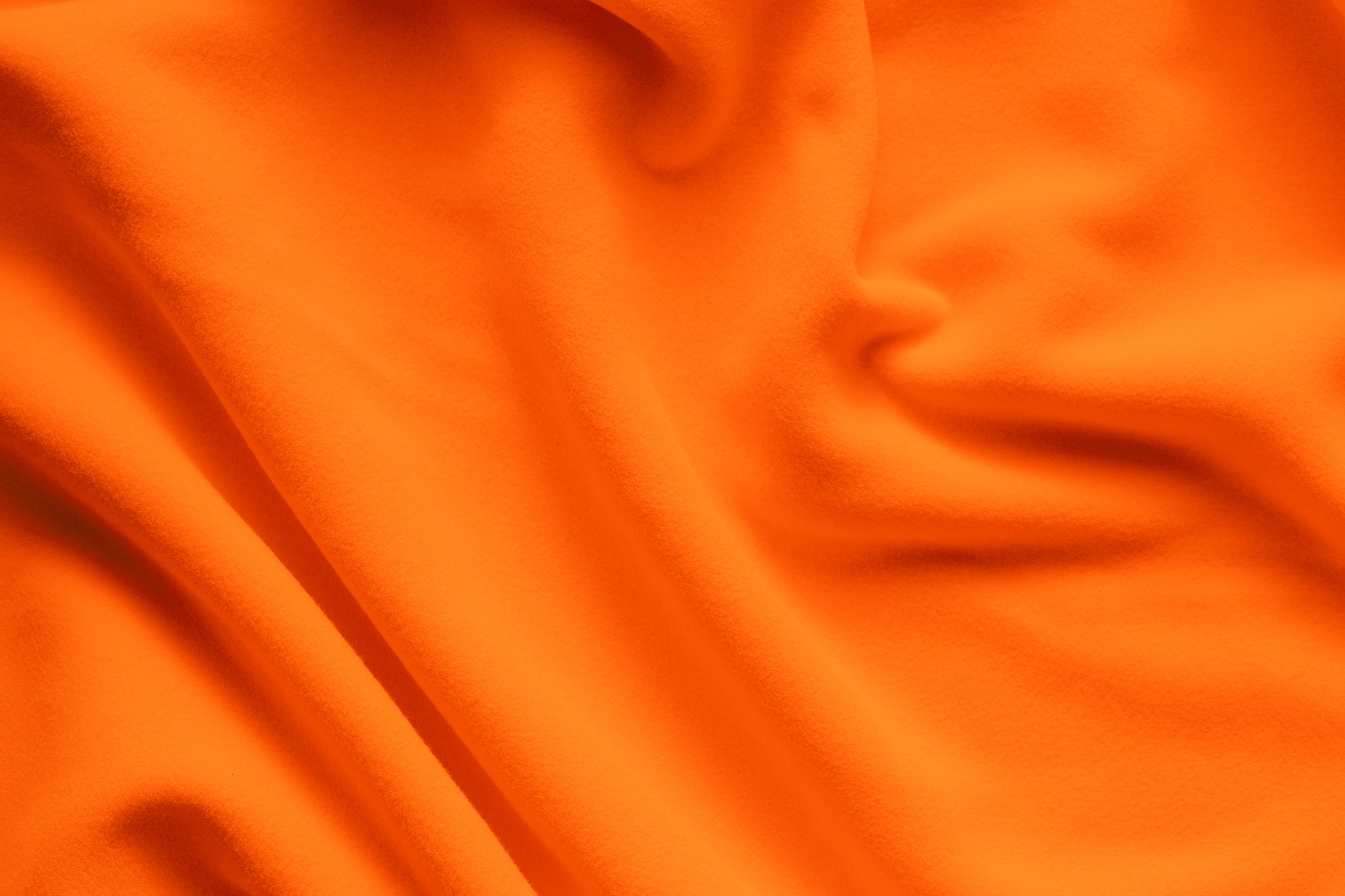 Background texture of bright orange fleece