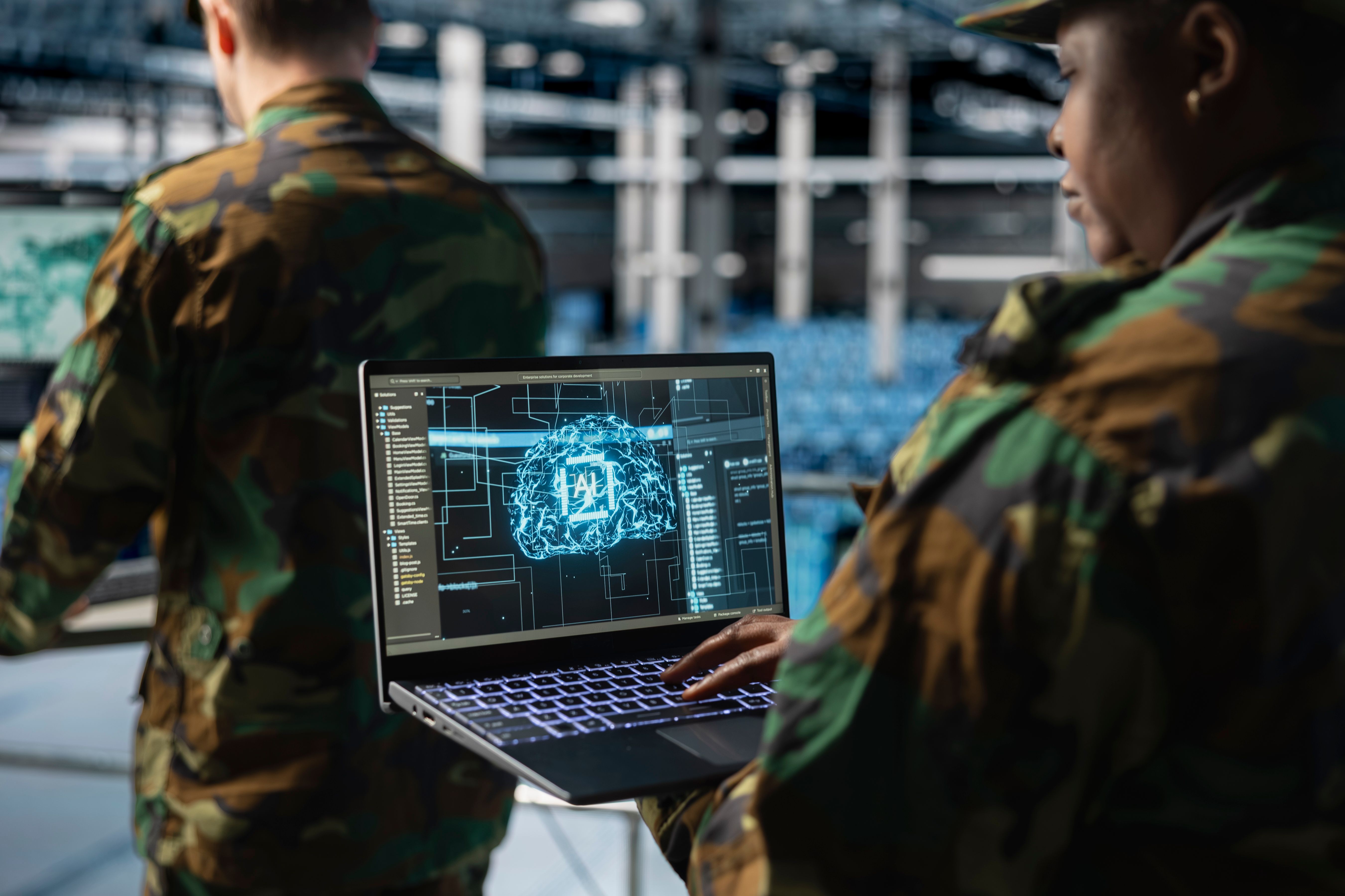 Close up of army technology expert in data center analyzing threats with AI Close up of army technology expert in data center analyzing threats with AI