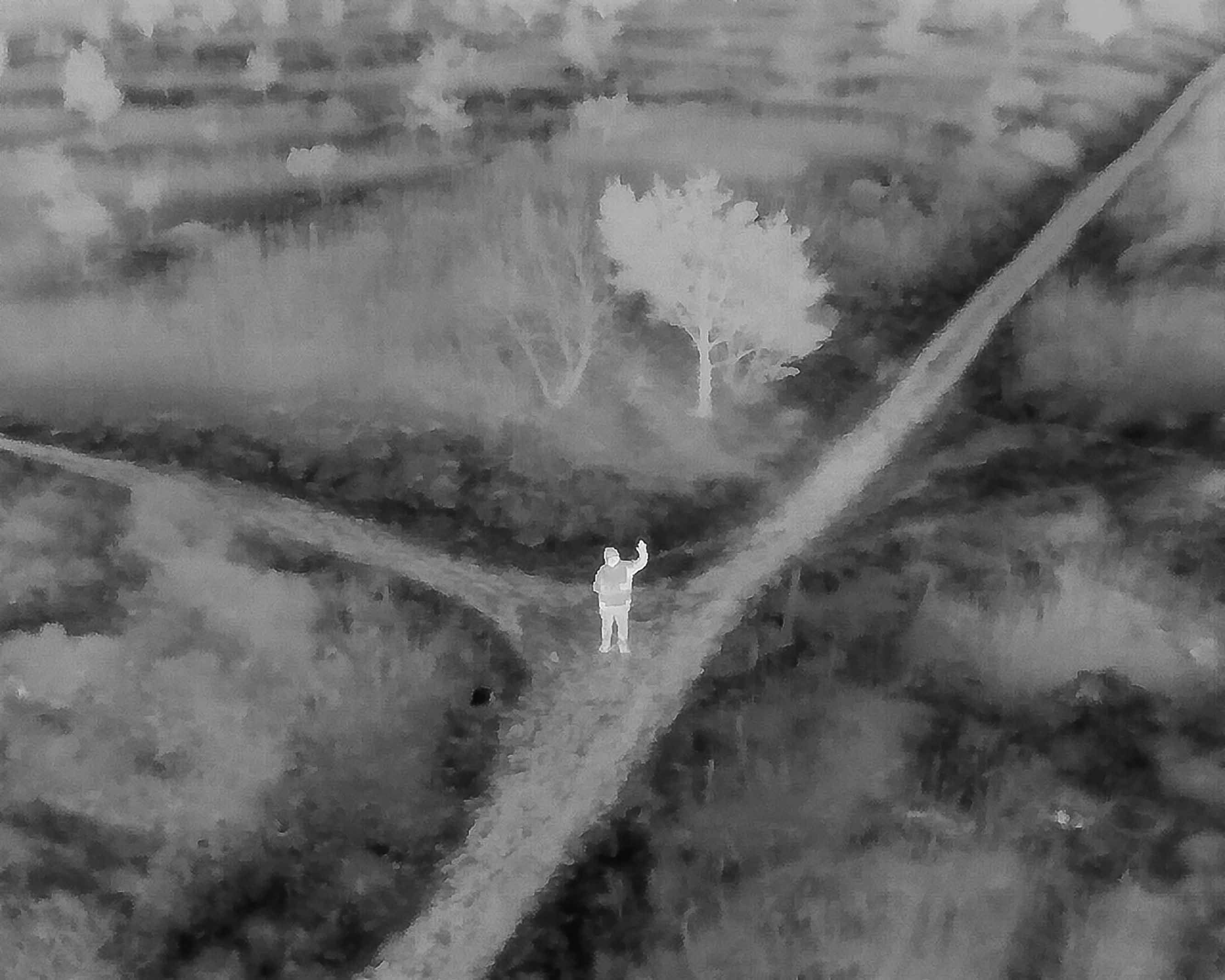 Drone Thermal image of a person waving in the dark