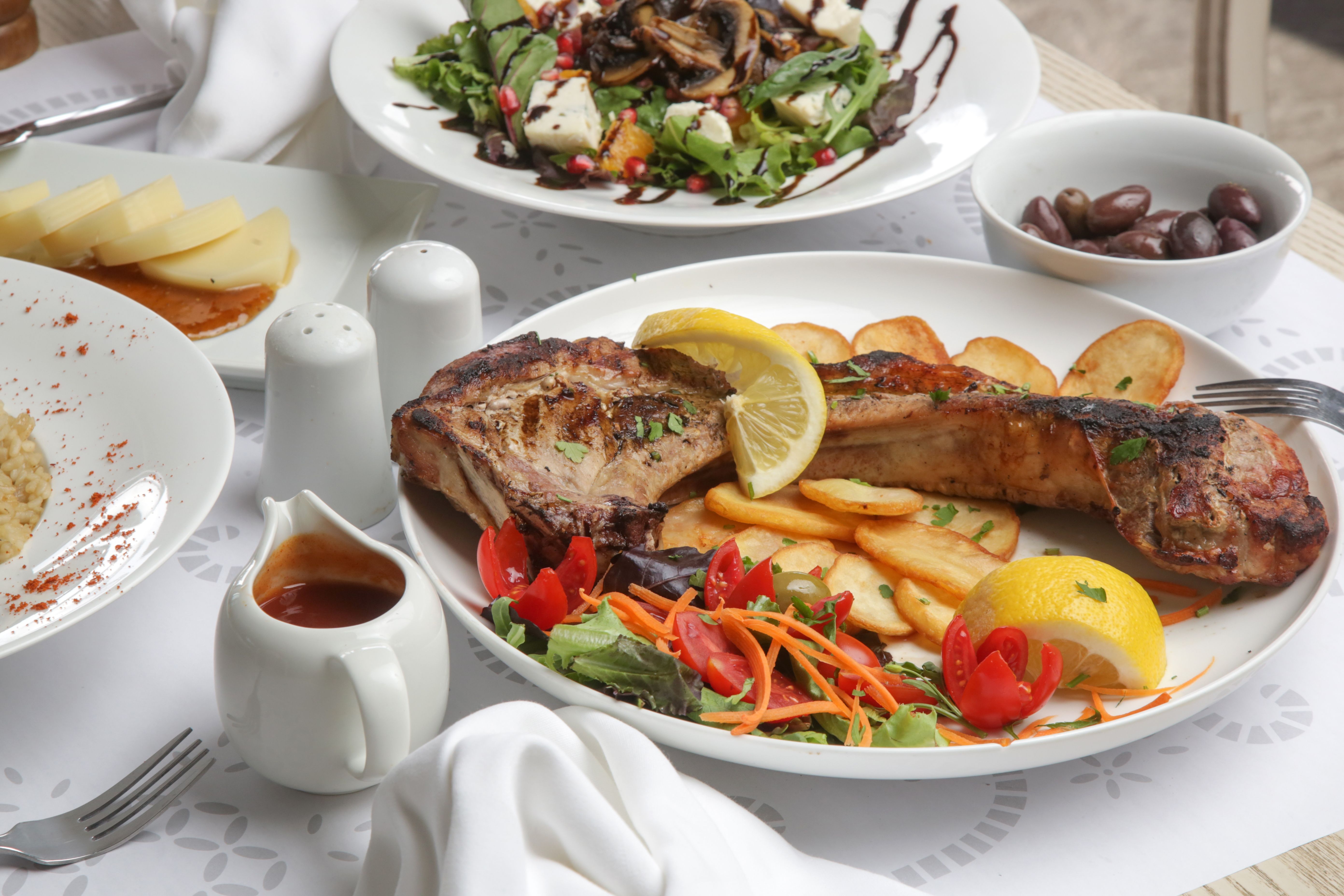 Various Mediterranean dishes served on the restaurant table