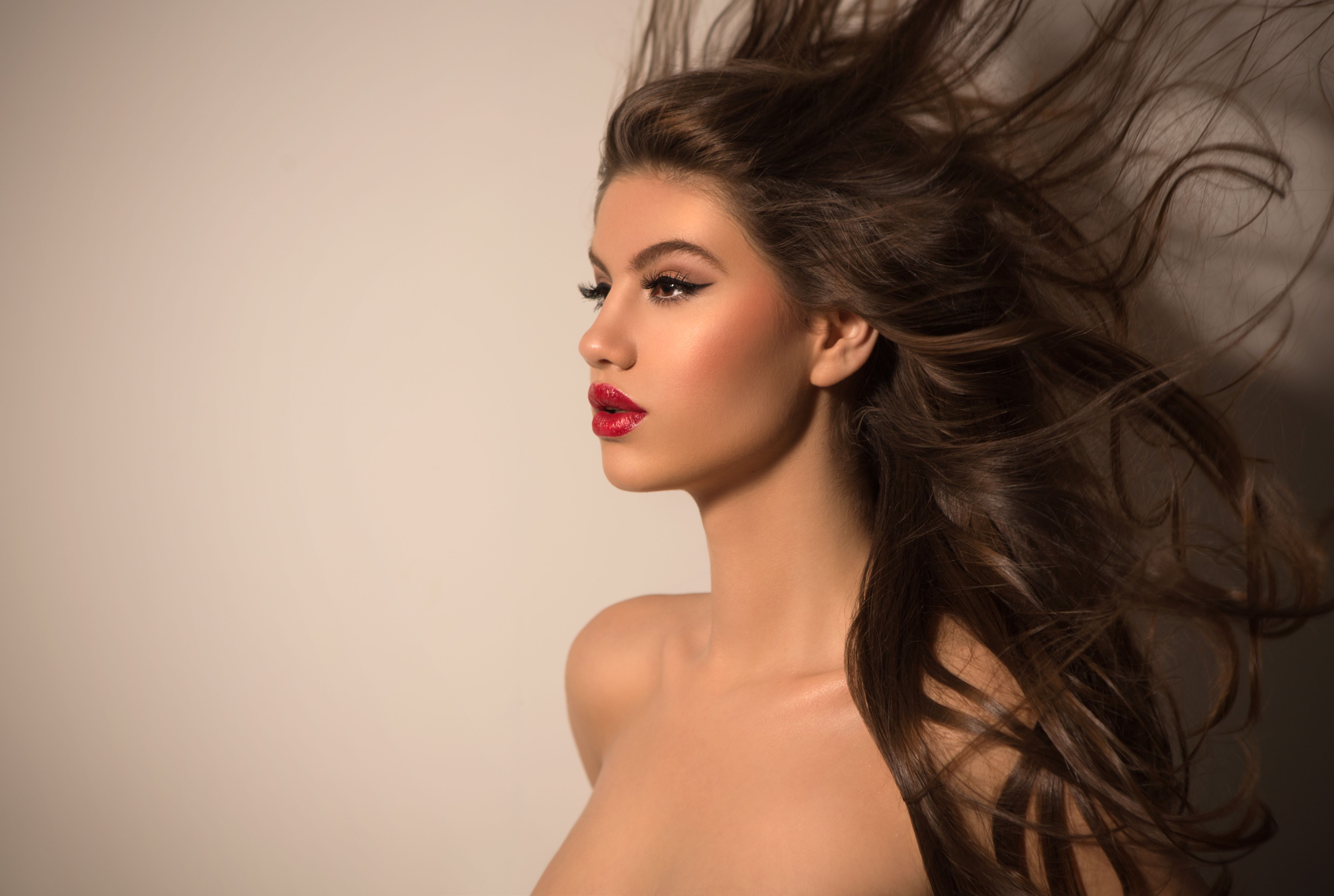 Brunette woman with flying hair. Brunette woman with flying hair.