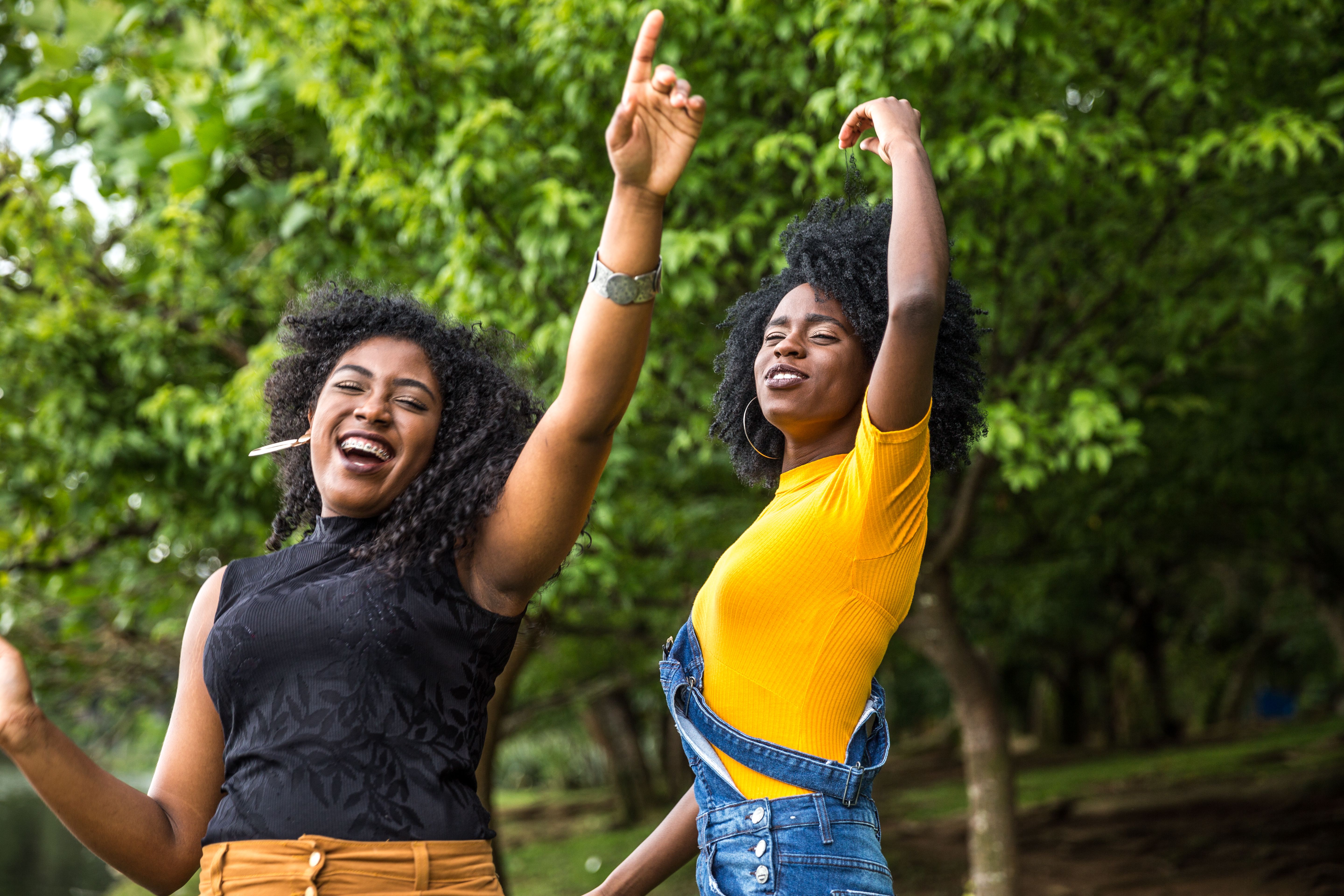 Afro descent girls dancing in the park