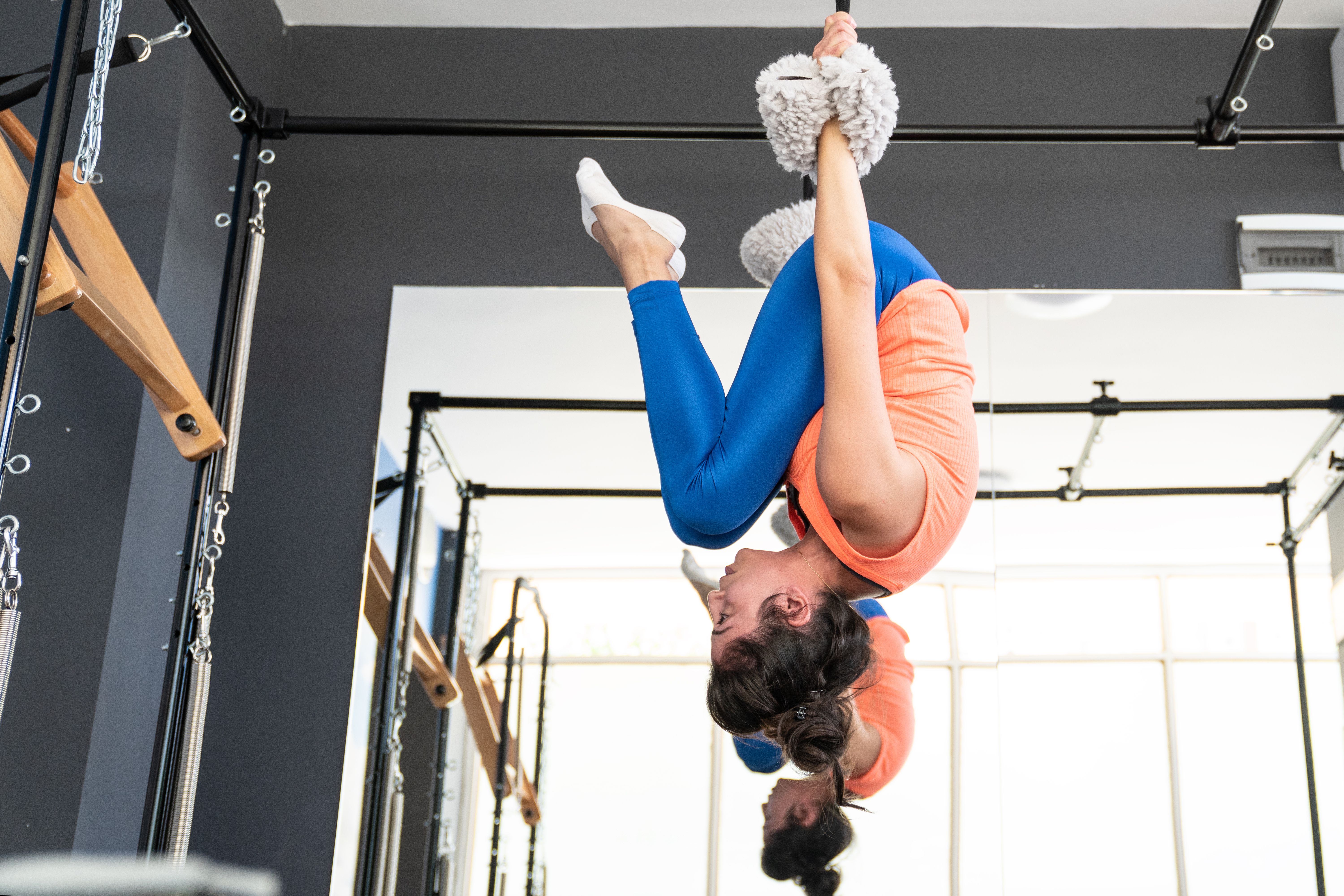 Adult Woman Exercising Reformer Pilates In Gym Adult Woman Exercising Reformer Pilates In Gym