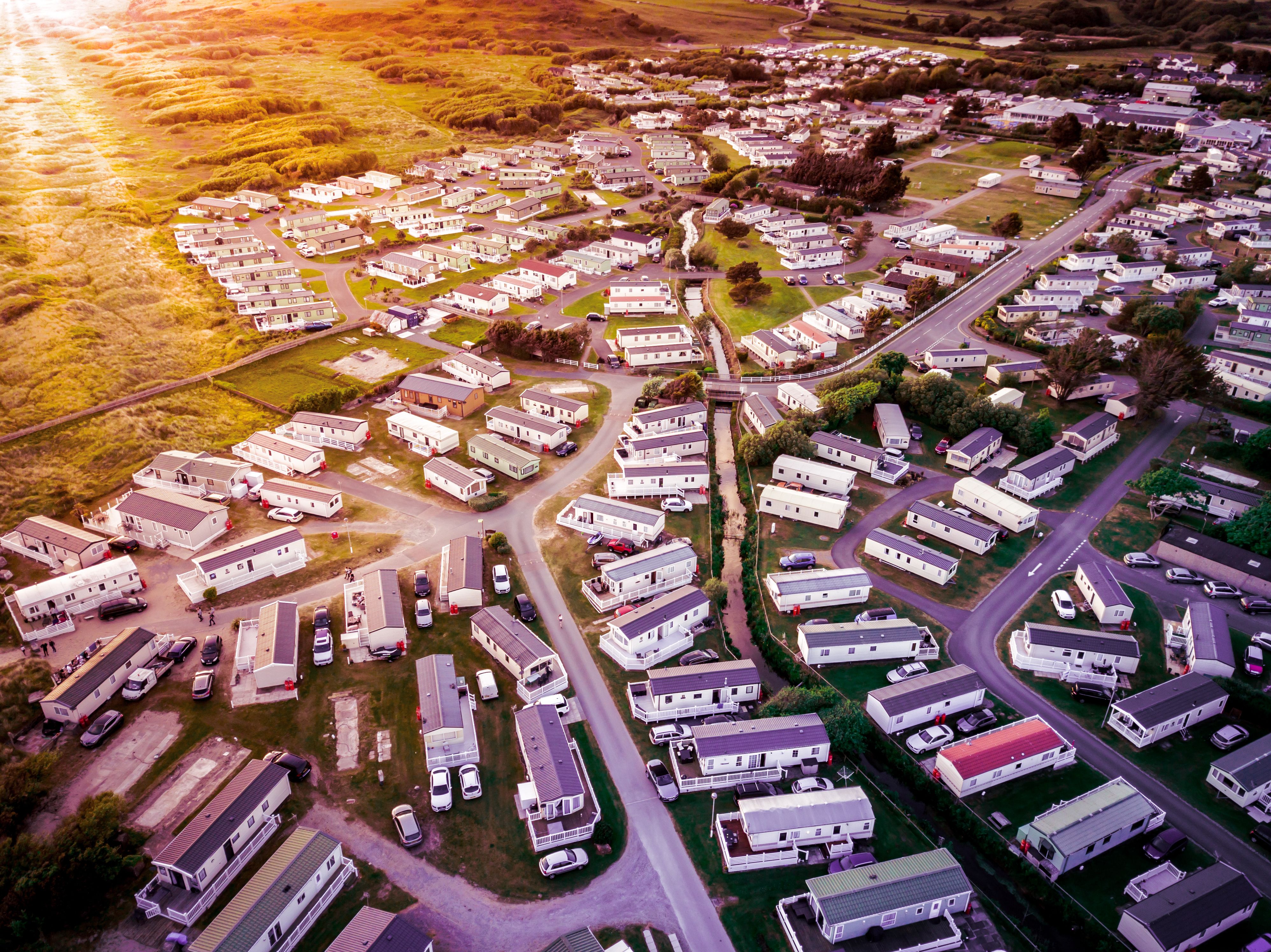 Sun set at a Caravan and camping park, static home aerial view.