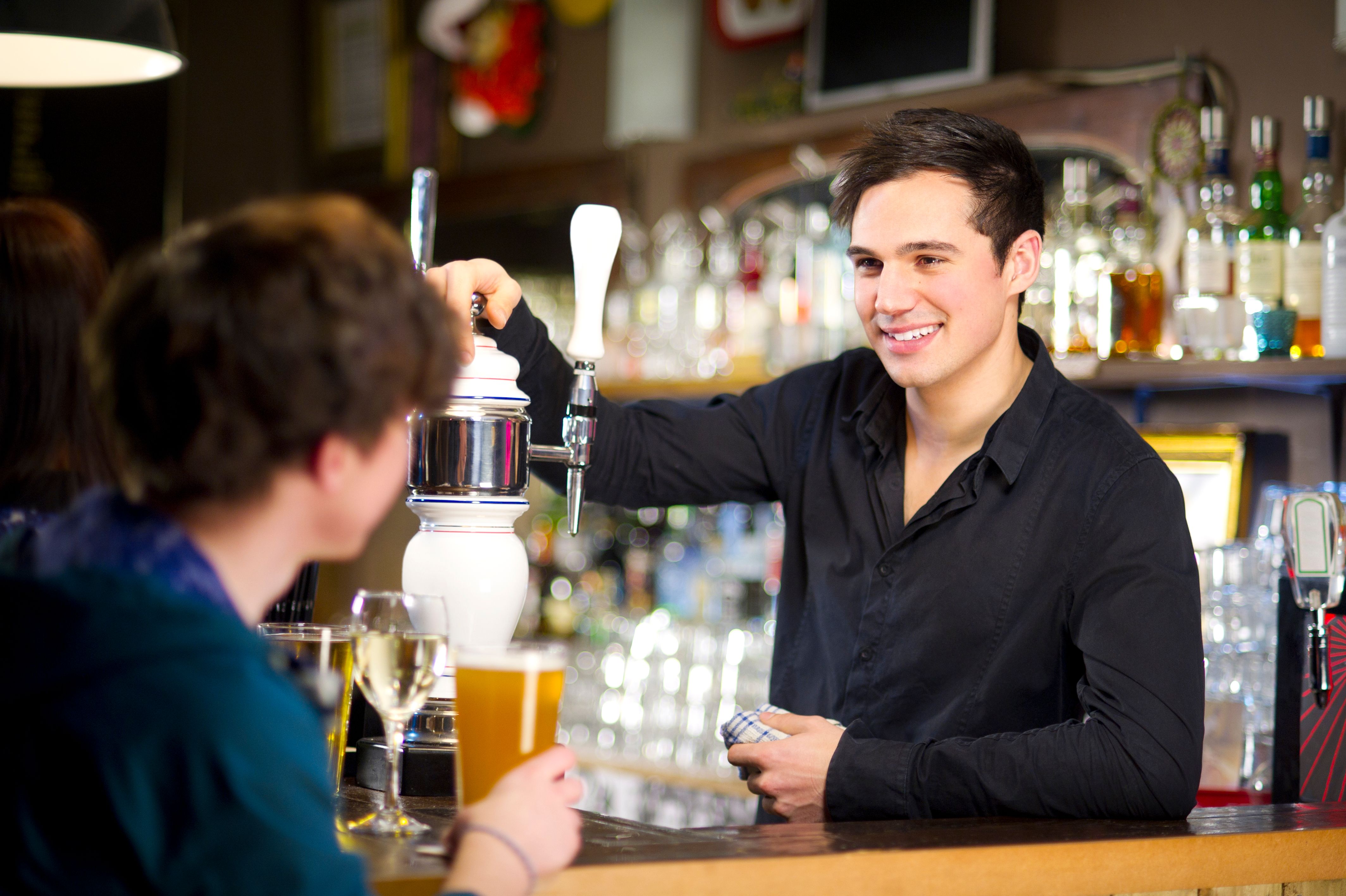 bartender with patrons