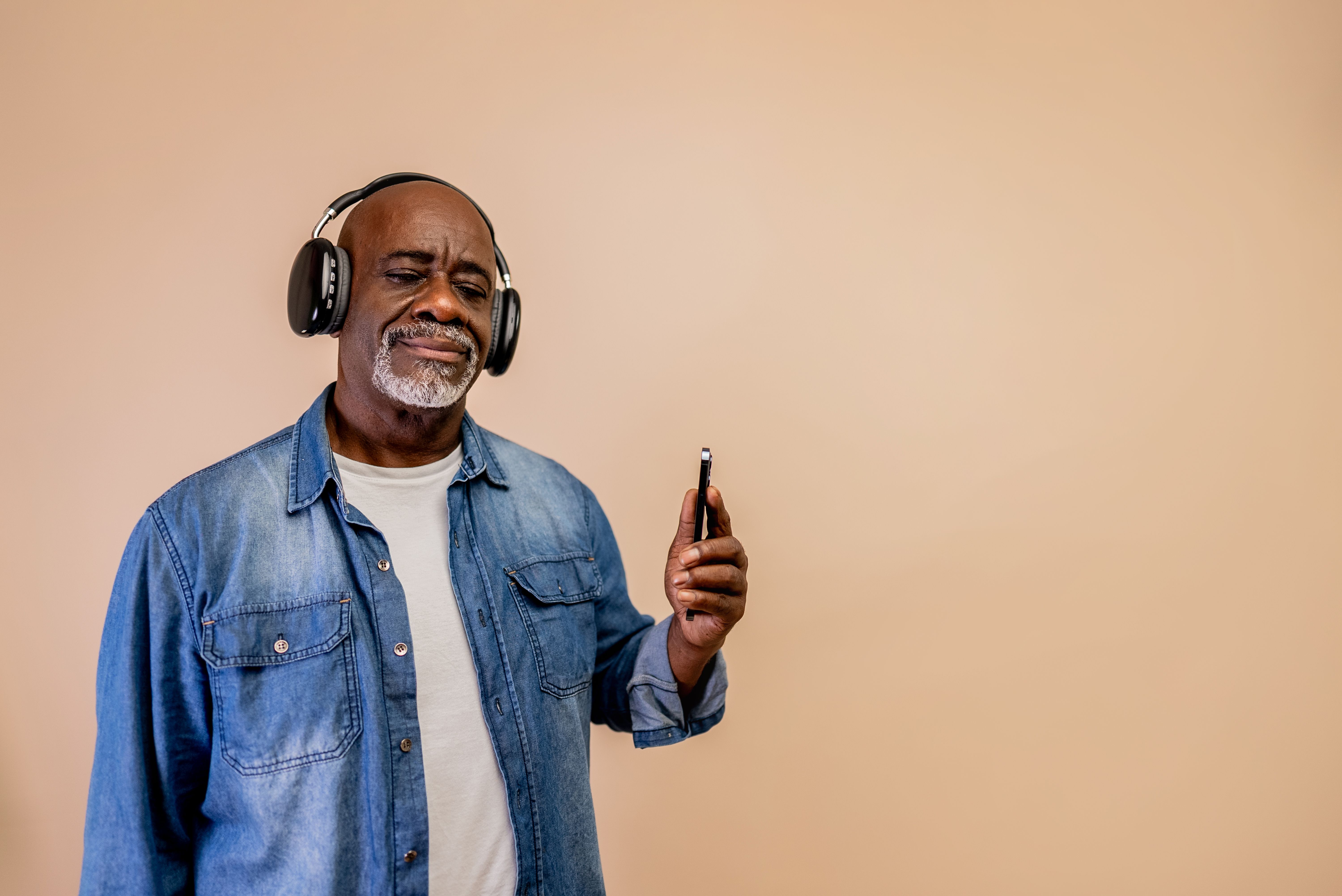 senior with headphones