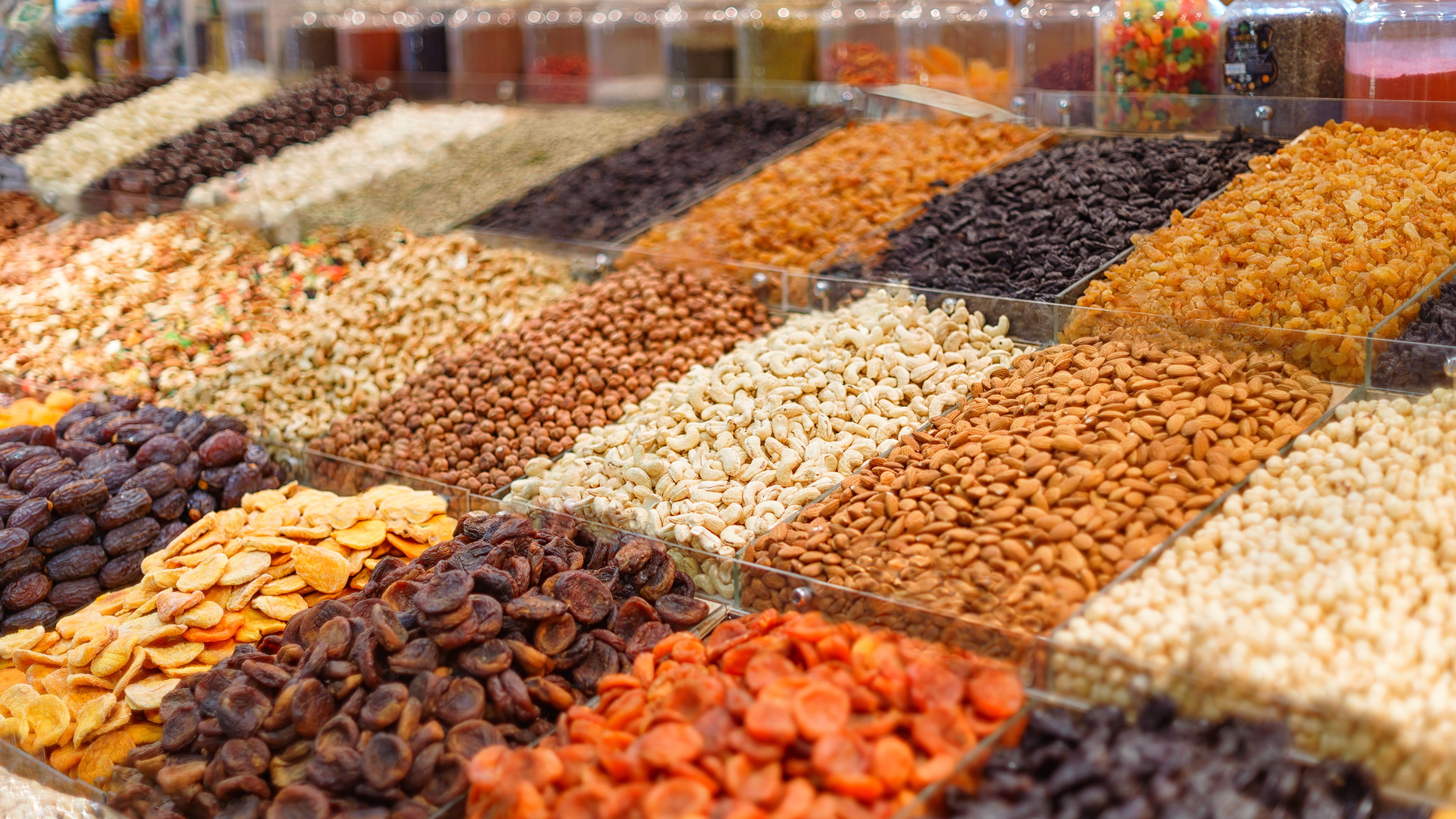 Stalls with nuts and dried fruits in the market close up with selective focus