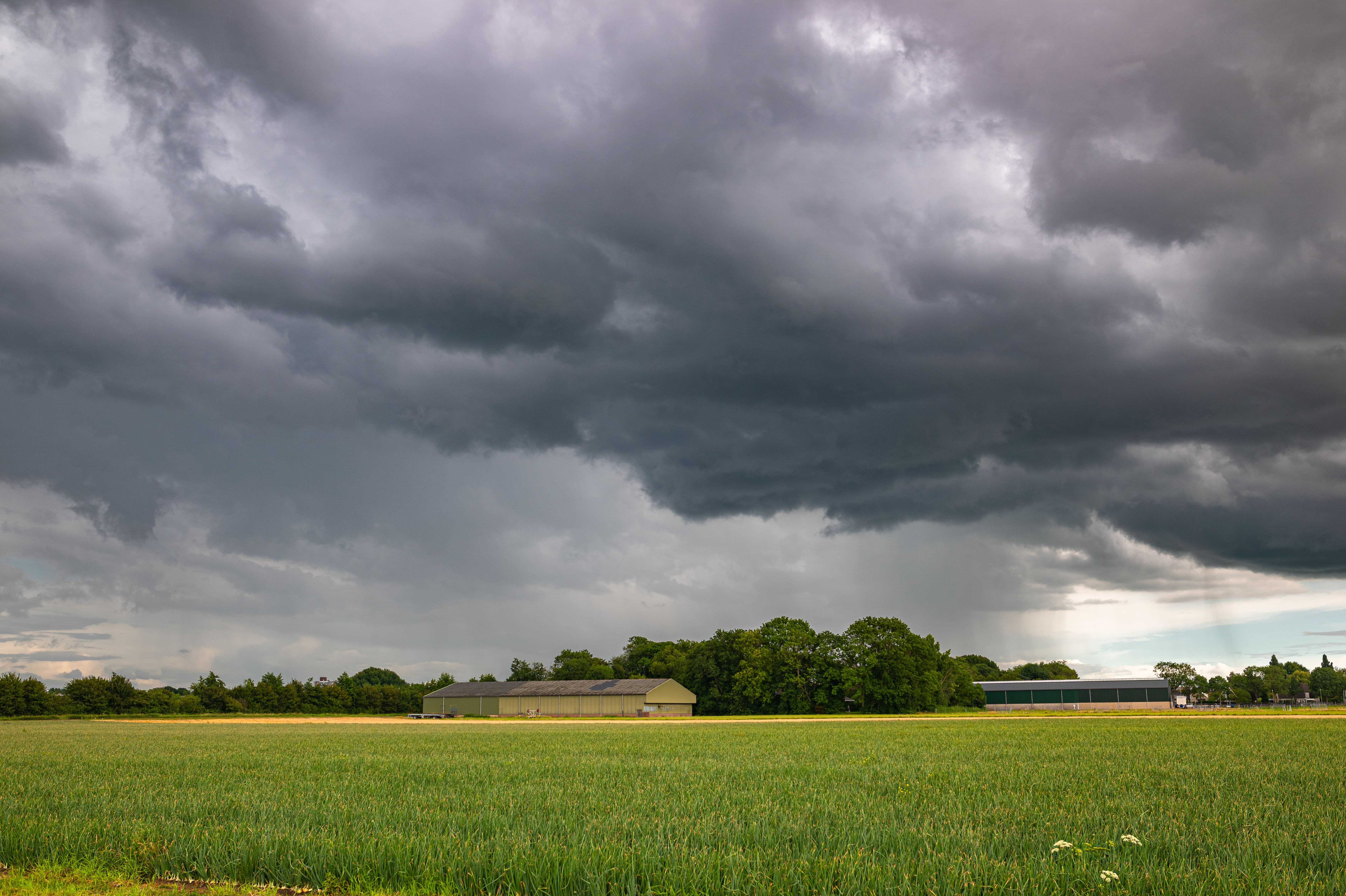 Rural Landscape with Dramatic Sky Showing Storm Clouds and Farmland