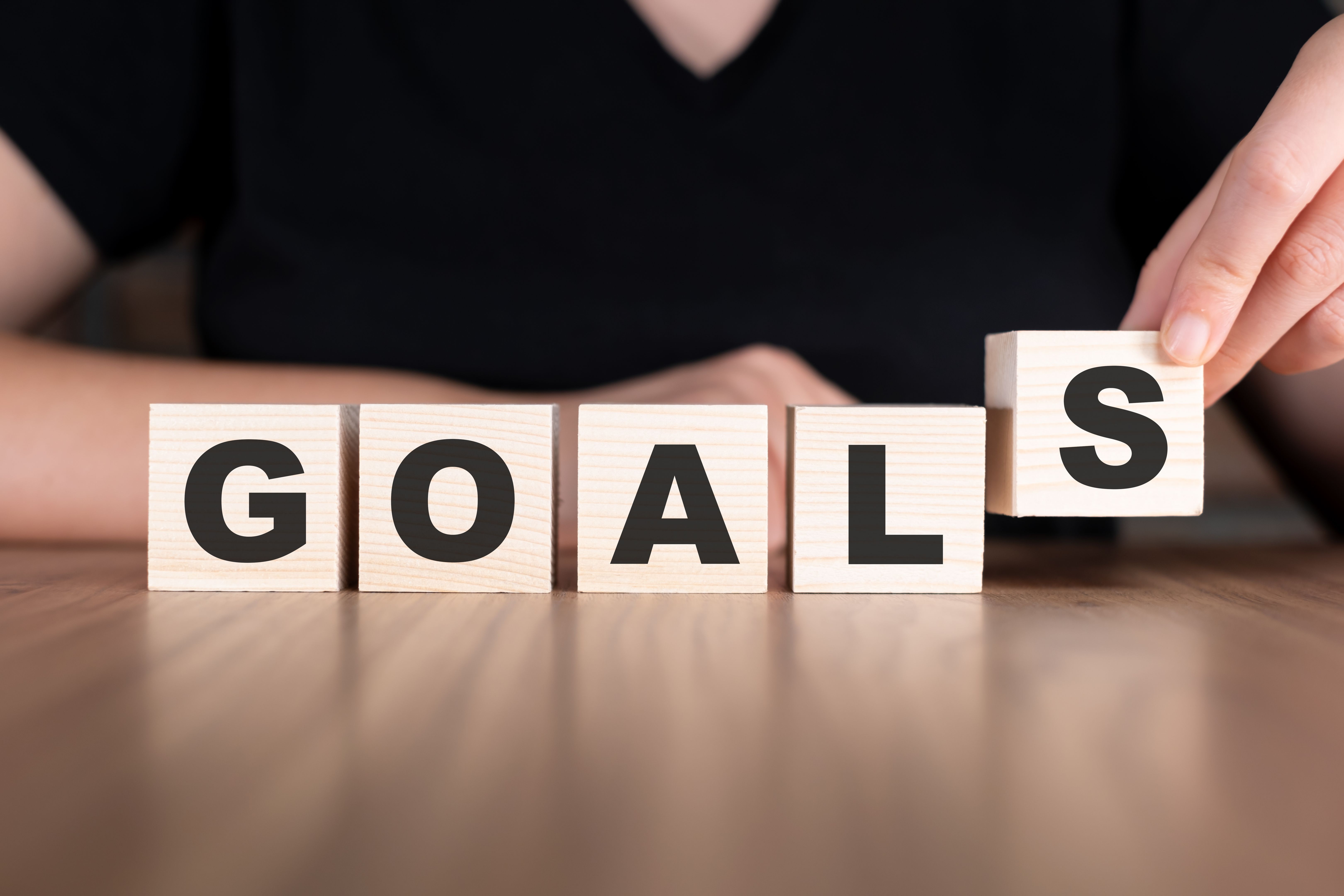 Goals word with wooden blocks on table Goals word with wooden blocks on table