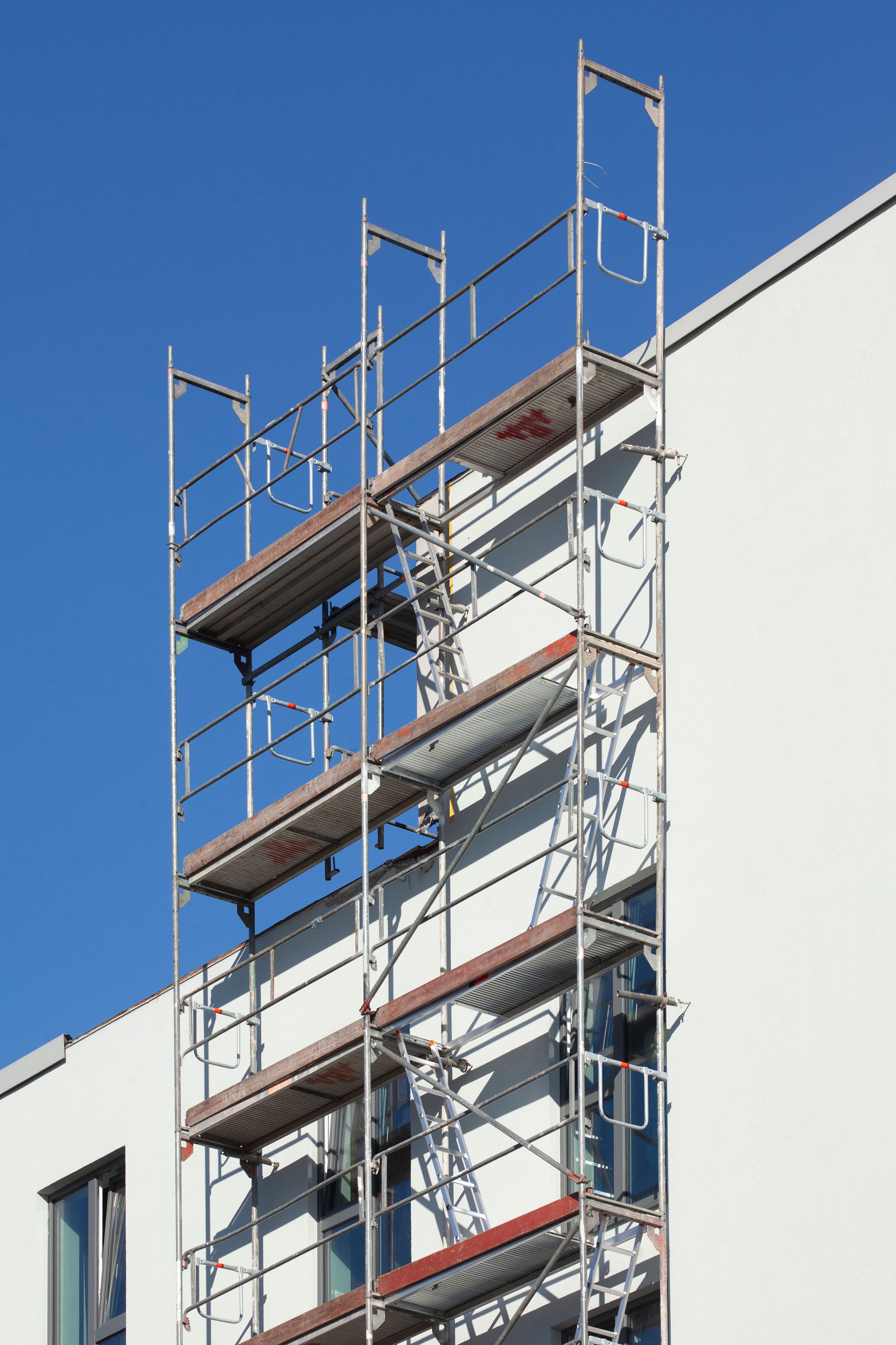 Scaffolding, Construction site, Modern white residential building, Bremen, Germany Scaffolding, Construction site, Modern white residential building, Bremen, Germany