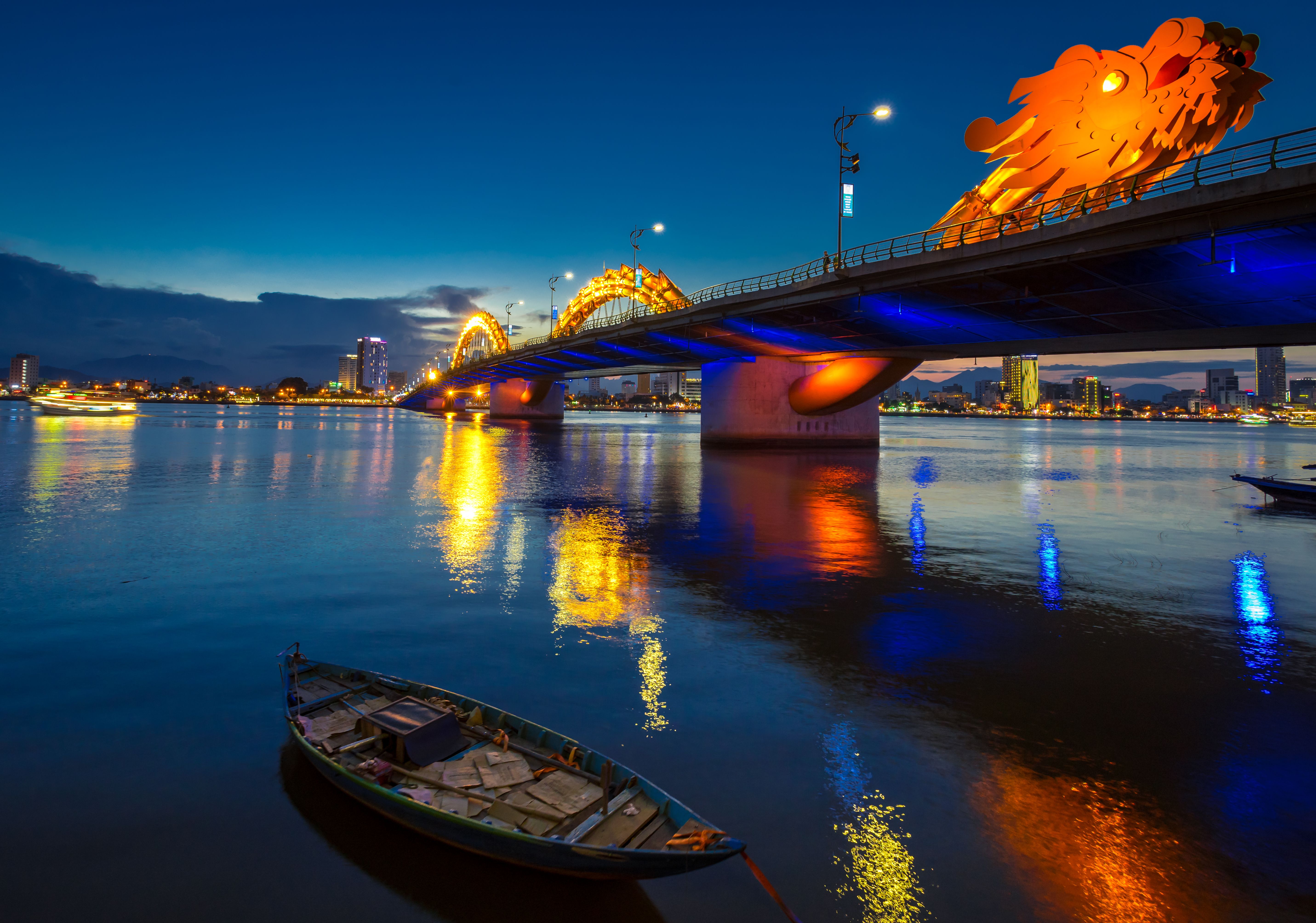 Dragon Bridge in Danang at night, with reflections on the river. Dragon Bridge in Danang at night, with reflections on the river.