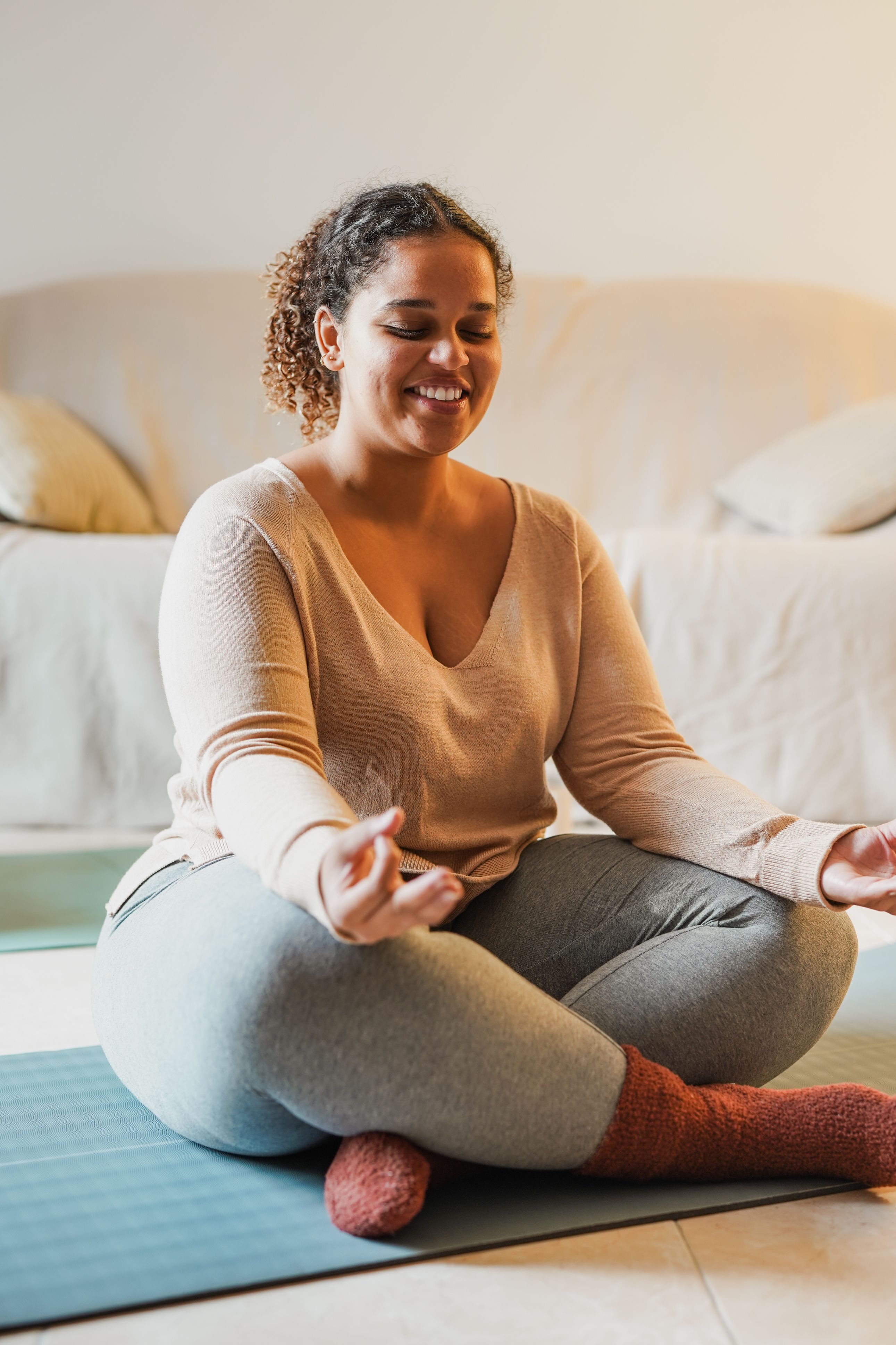 Young curvy african girl doing yoga exercise at home Young curvy african girl doing yoga exercise at home