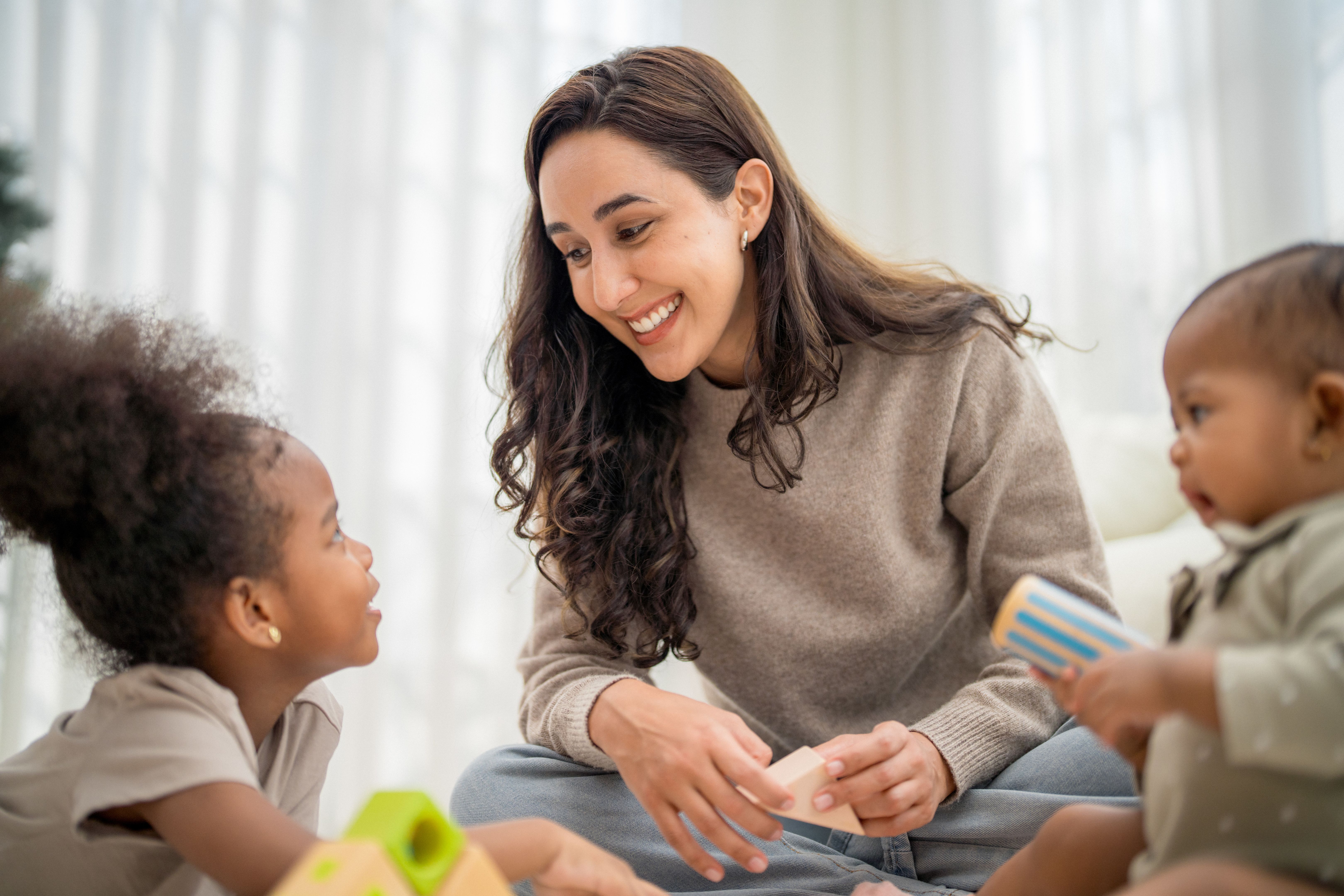 babysitter playing with children