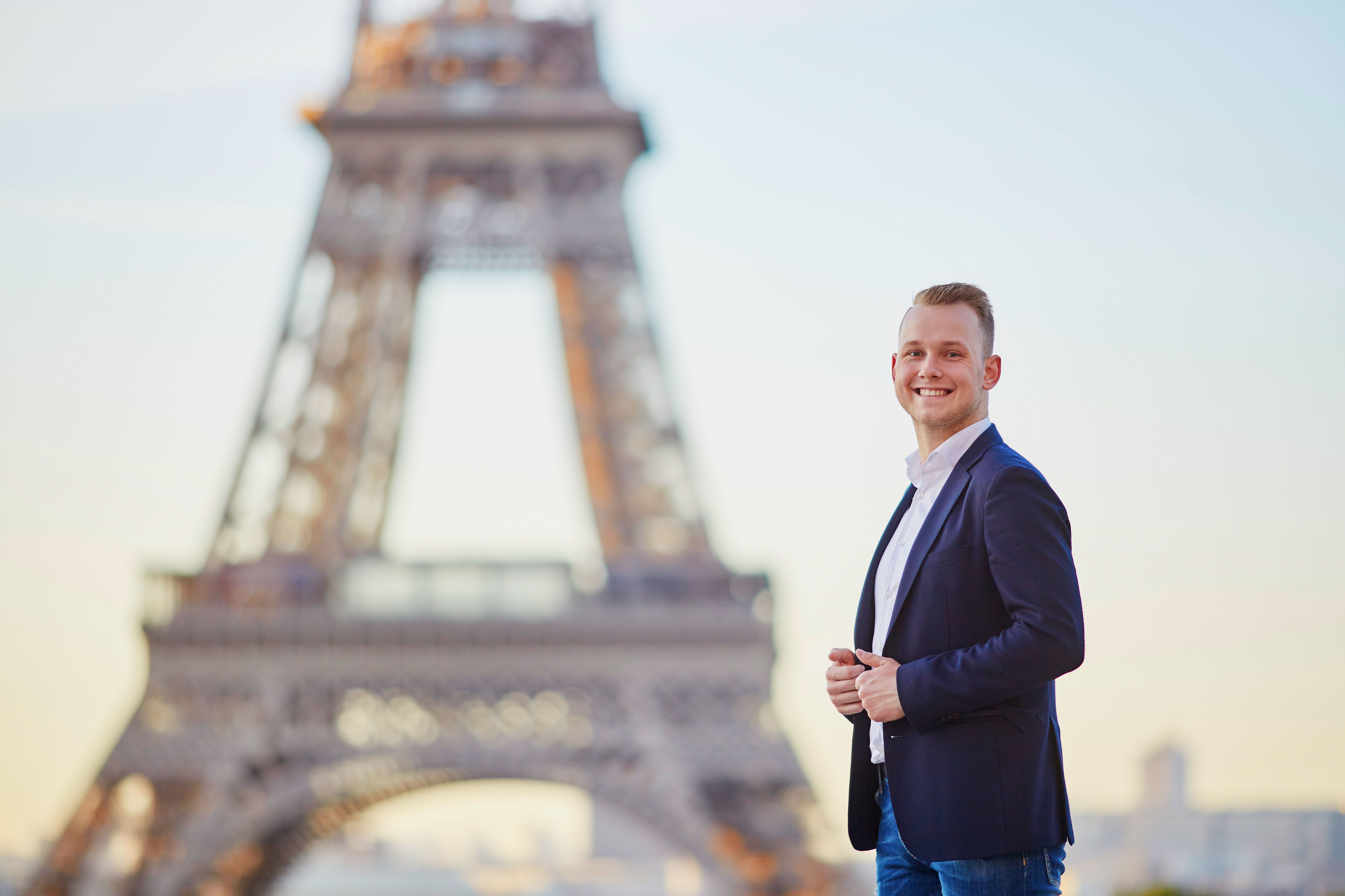 Handsome young man near the Eiffel tower