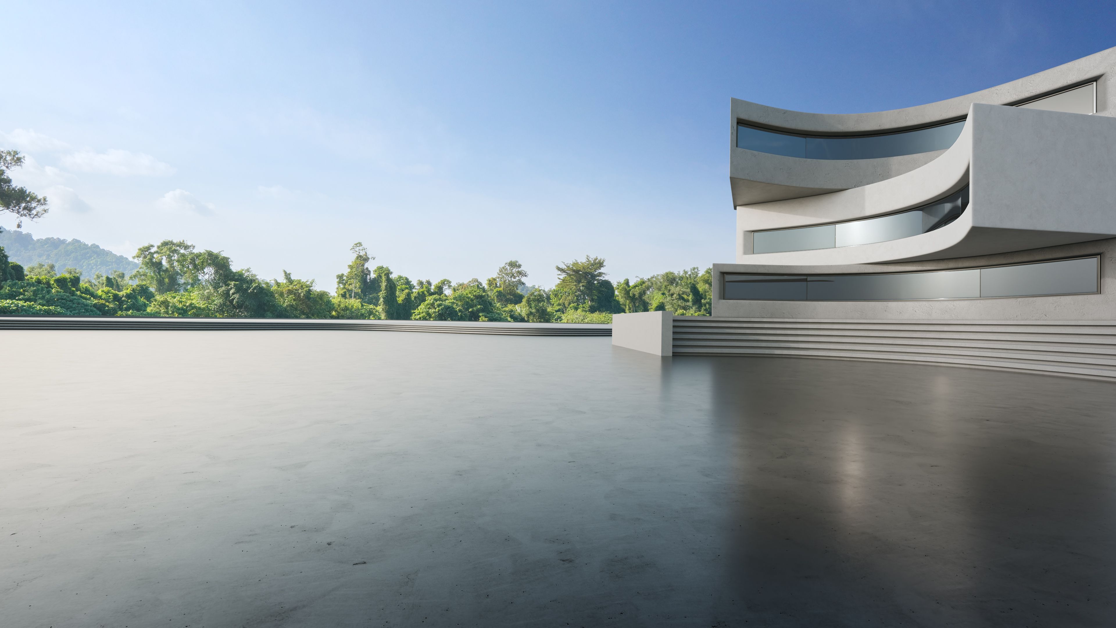 Abstract architecture design of modern building. Empty parking area concrete floor with blue sky.
