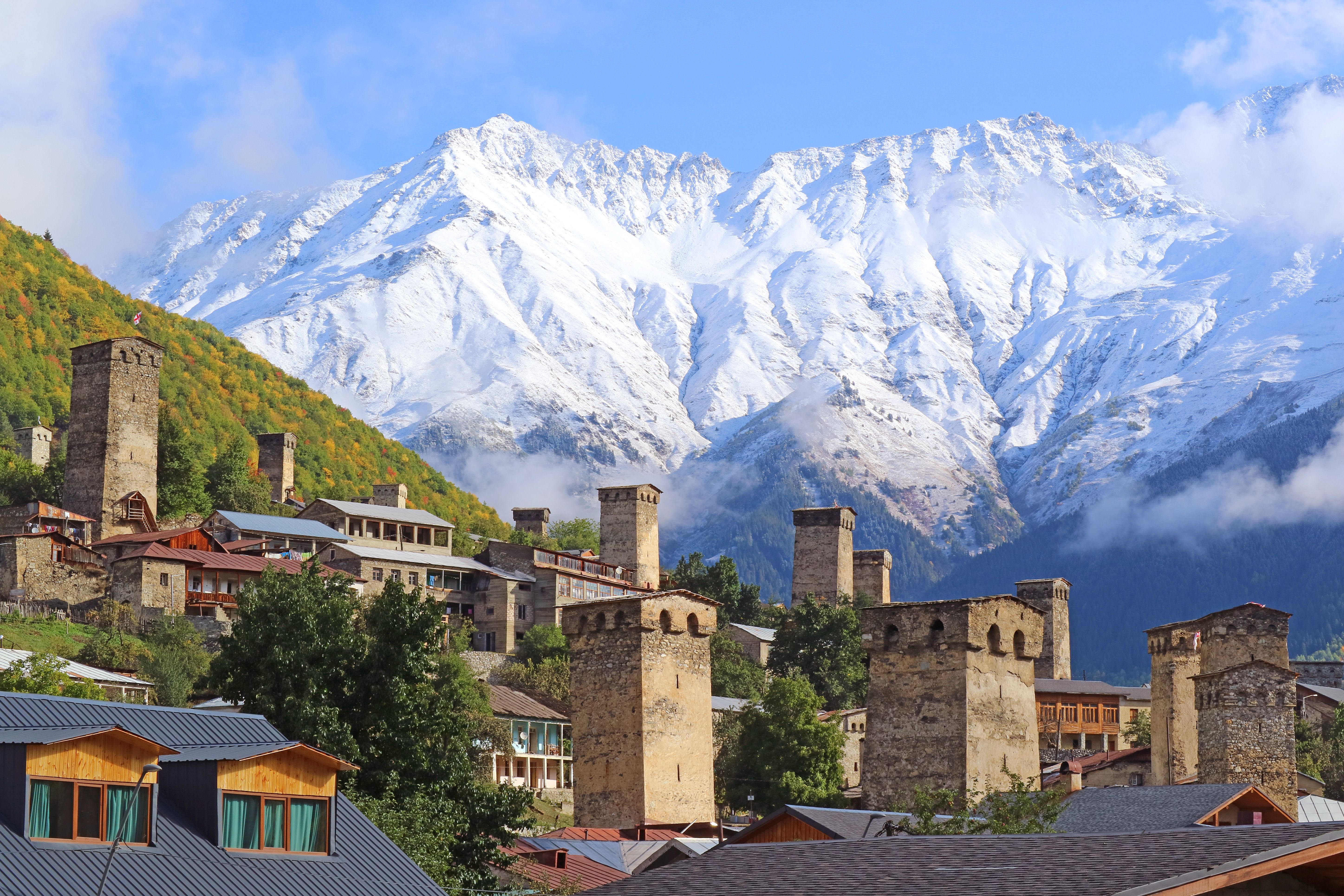 Amazing View of Mestia Town with Medieval Svan Tower-houses and Snow Capped Caucasus Mountain Ranges, Svaneti Region, Georgia Amazing View of Mestia Town with Medieval Svan Tower-houses and Snow Capped Caucasus Mountain Ranges, Svaneti Region, Georgia