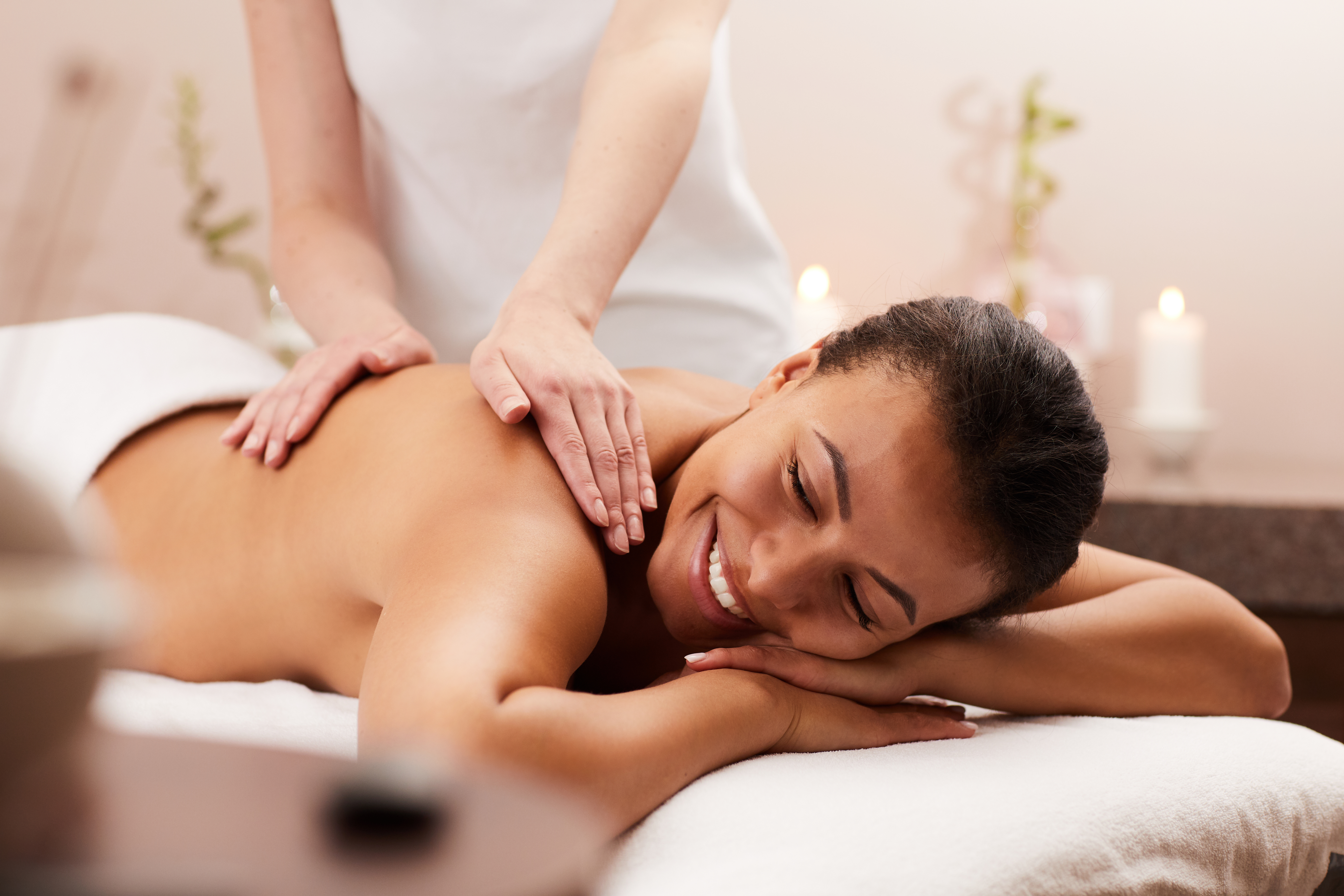 Smiling Woman Enjoying Massage in Spa Smiling Woman Enjoying Massage in Spa
