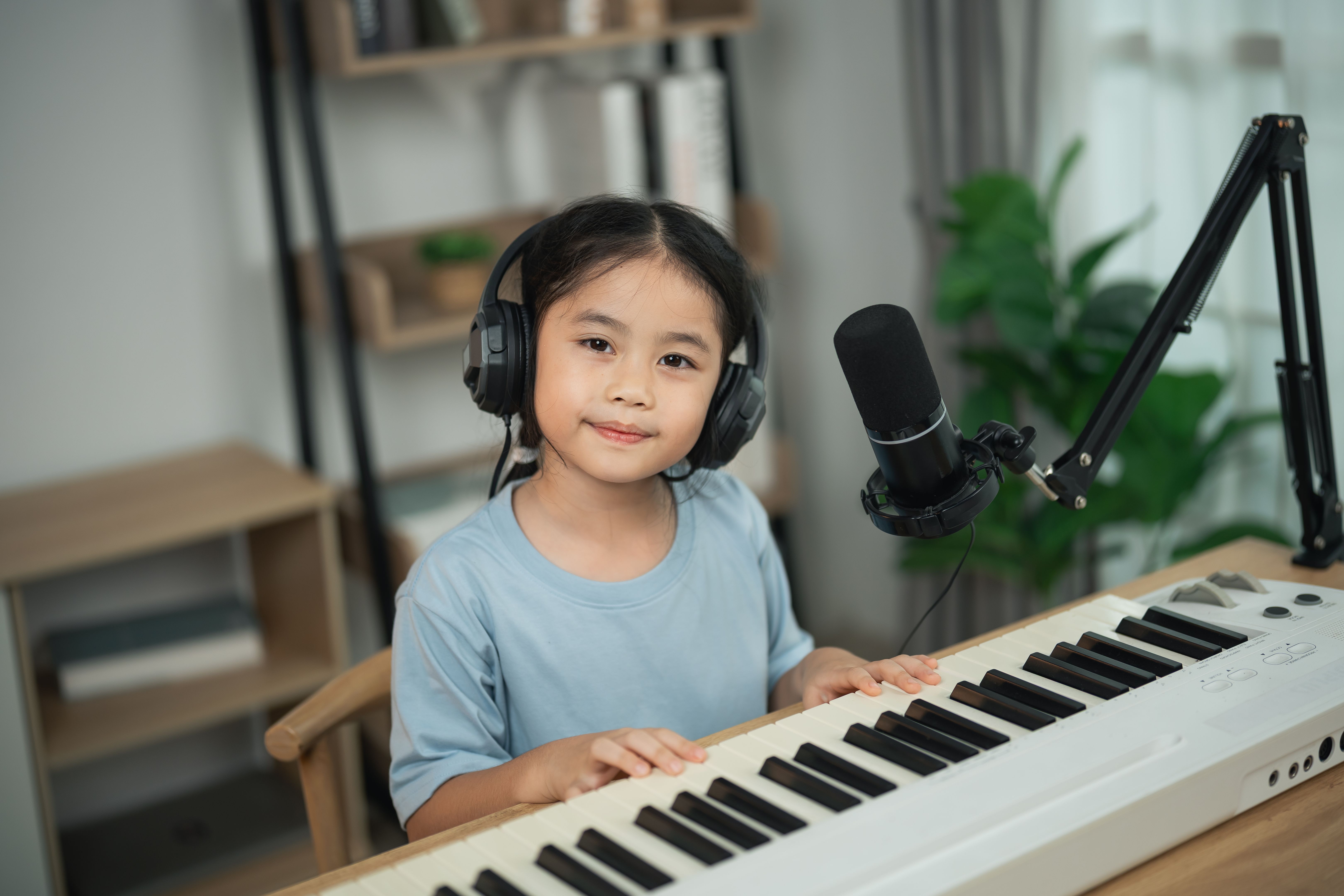 child practicing piano