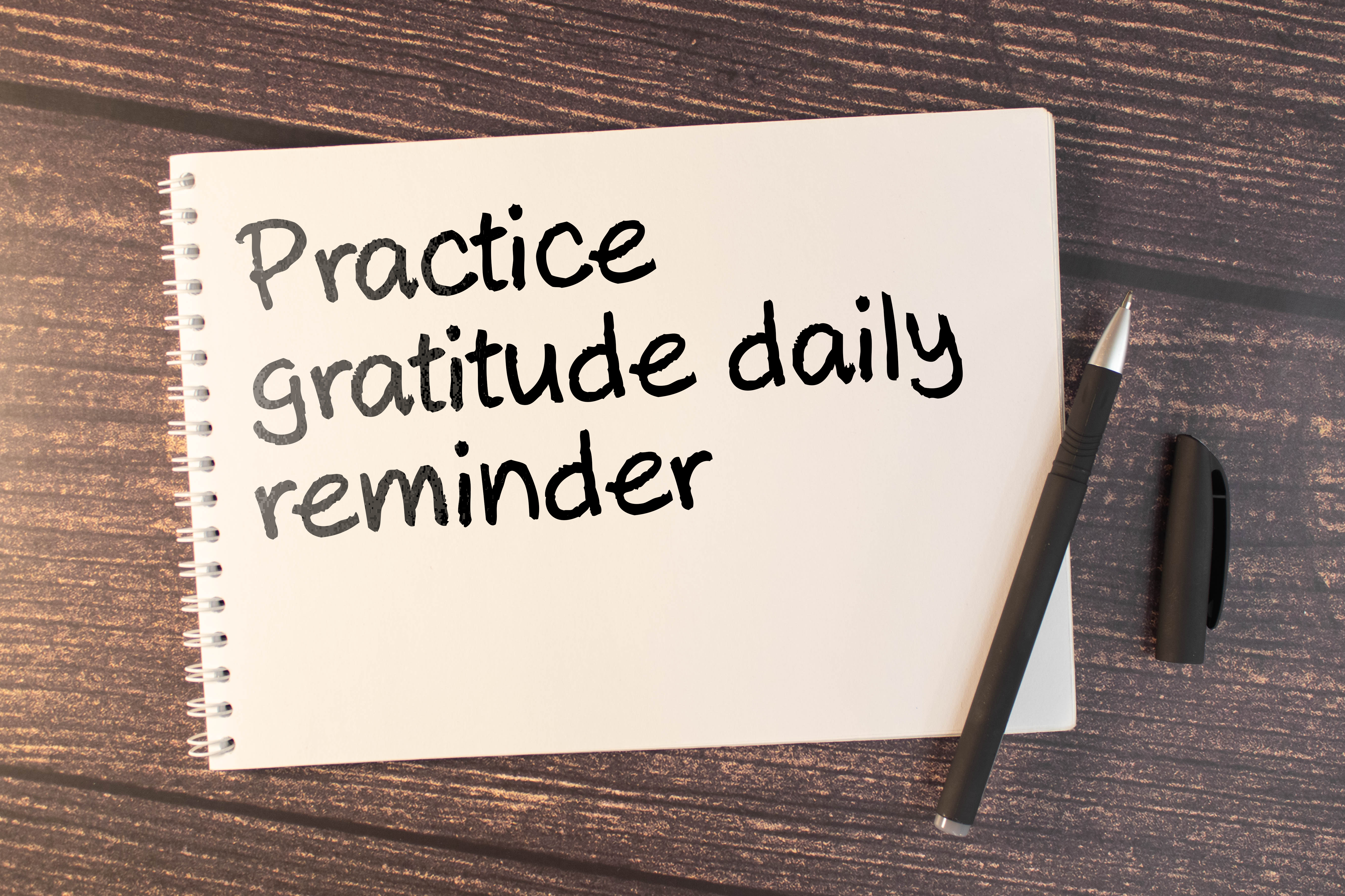 Practice gratitude daily reminder - inspirational handwriting on a napkin