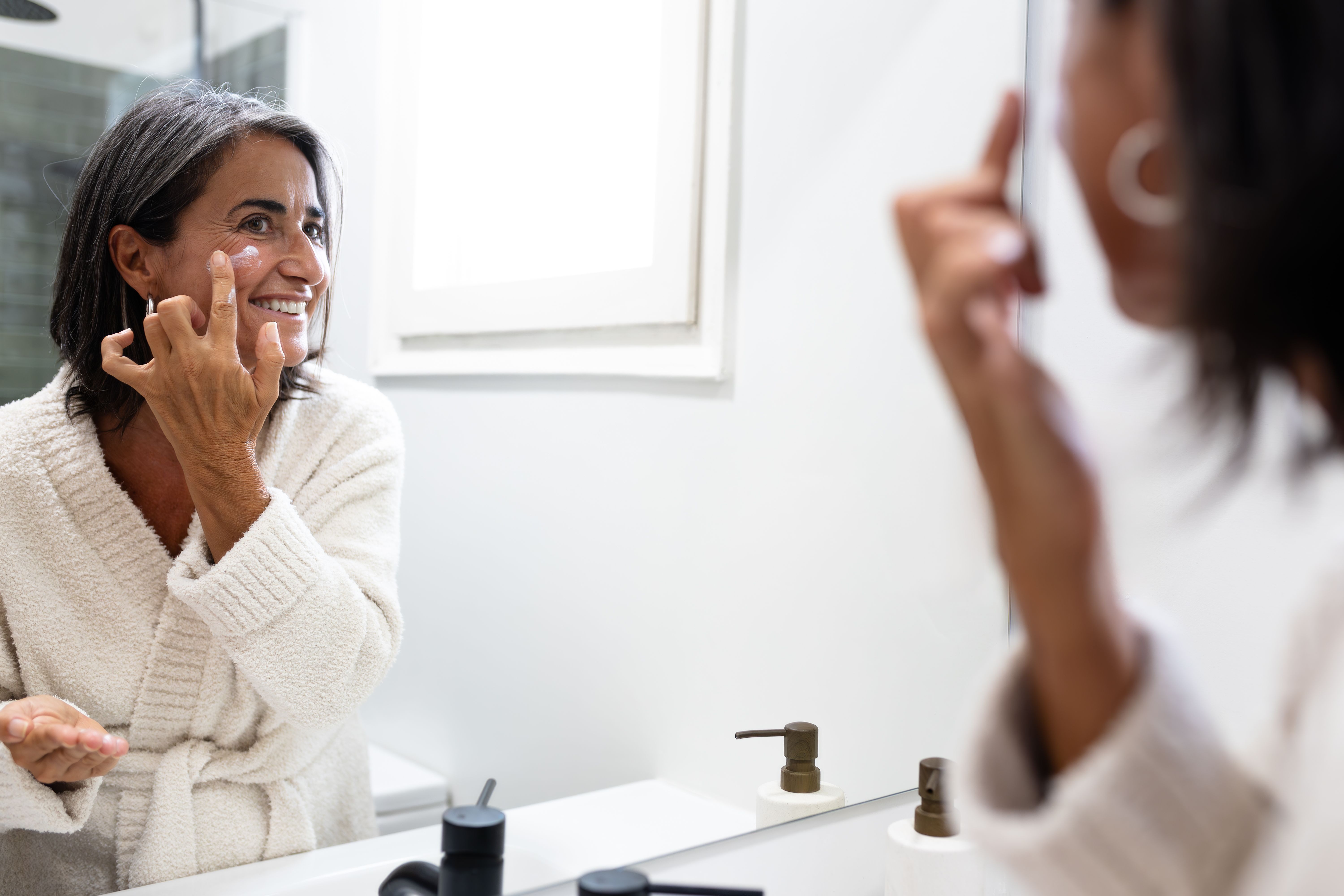 woman applying skincare