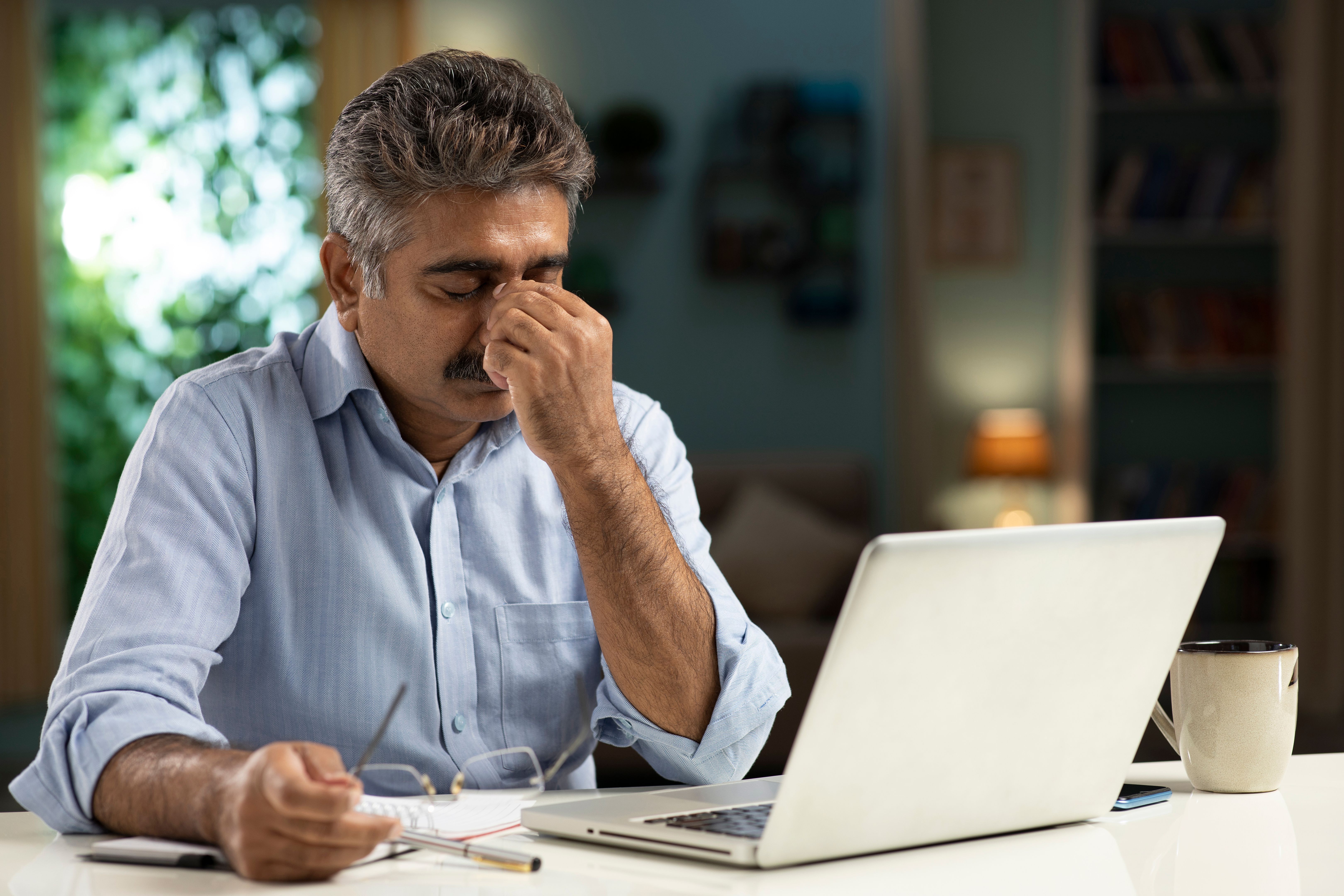mature man working from home stock photo