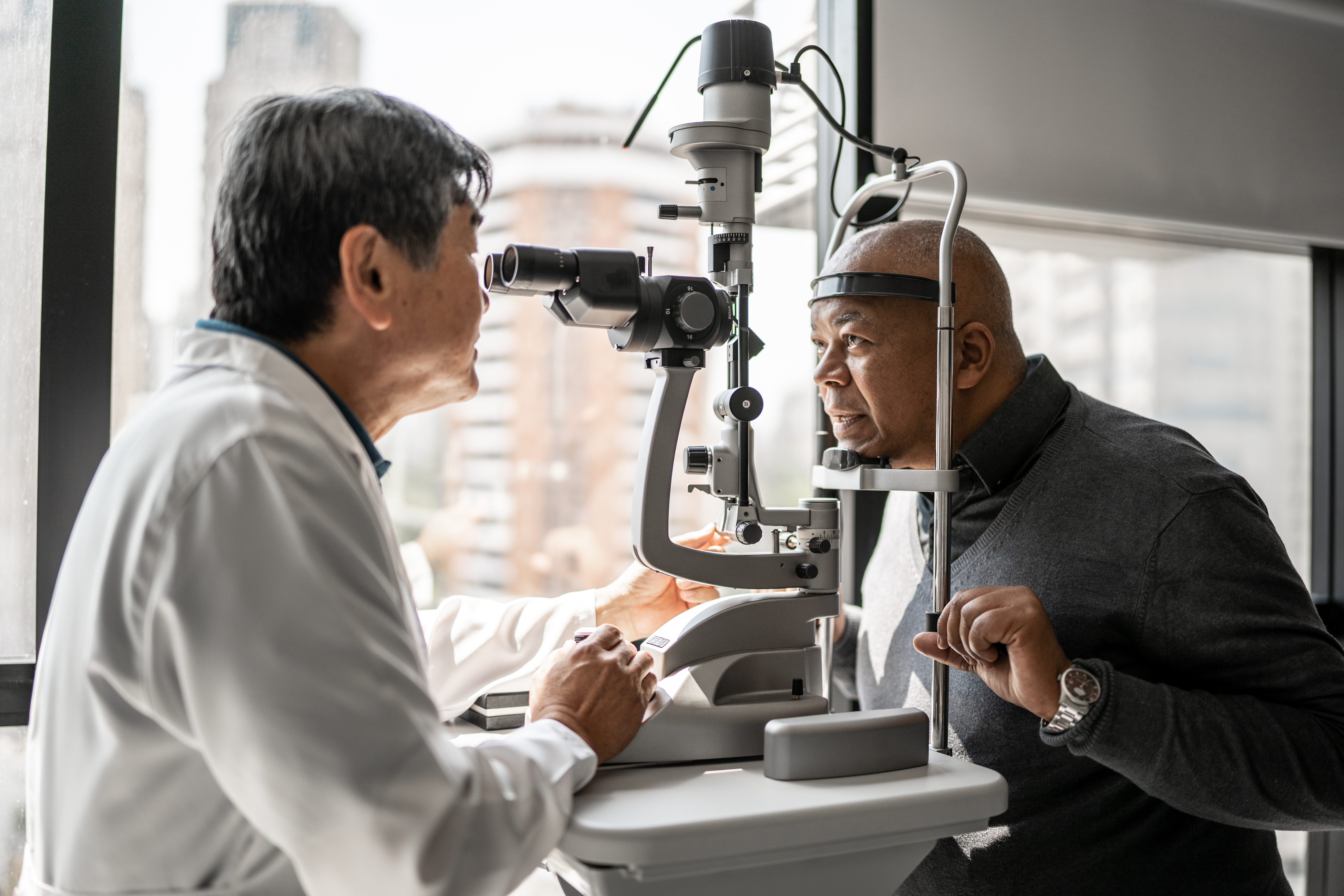 Ophthalmologist examining patient's eyes Ophthalmologist examining patient's eyes