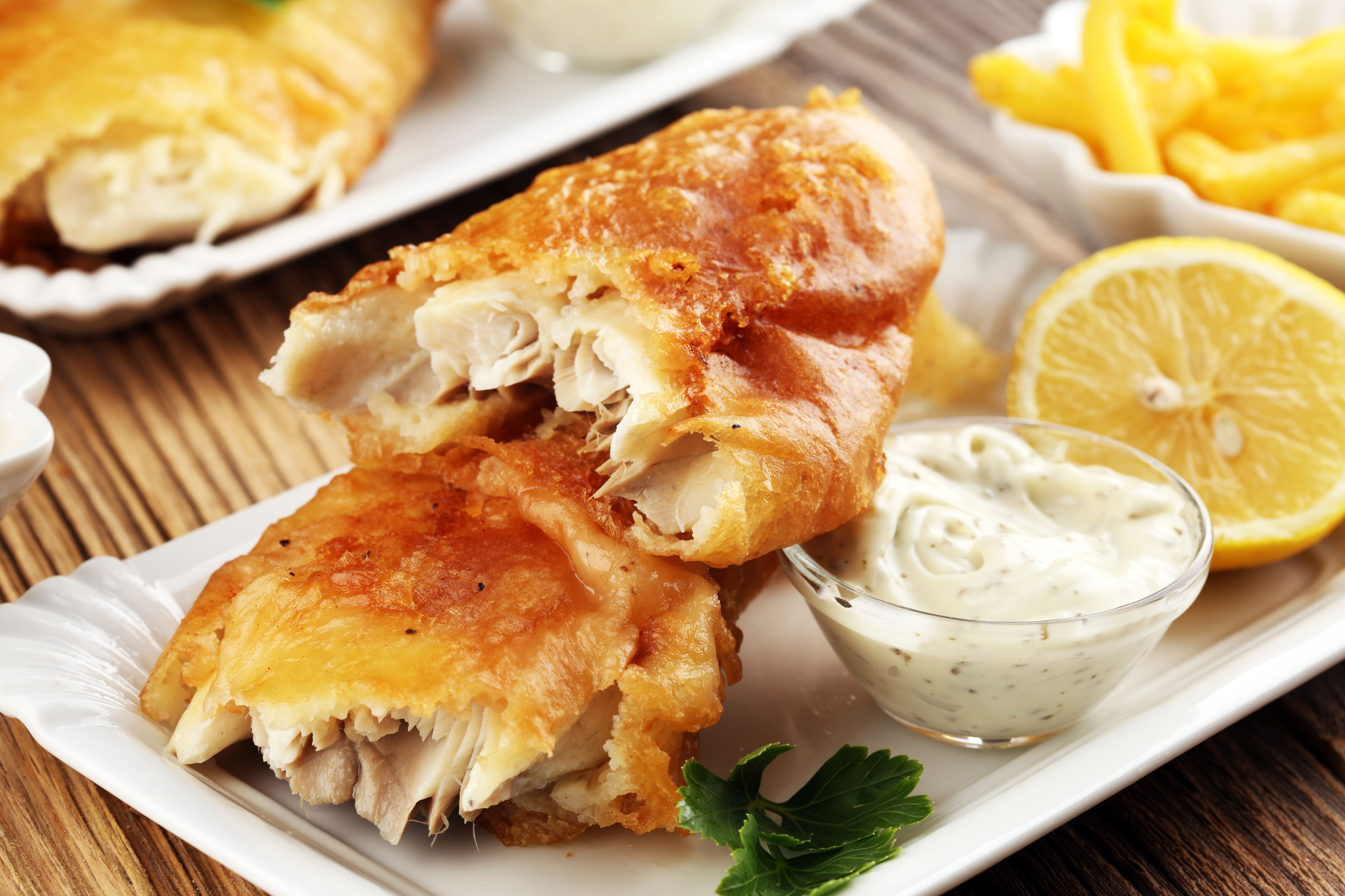 traditional British fish and chips consisting of fried fish, potato chips and mayonnaise traditional British fish and chips consisting of fried fish, potato chips and mayonnaise