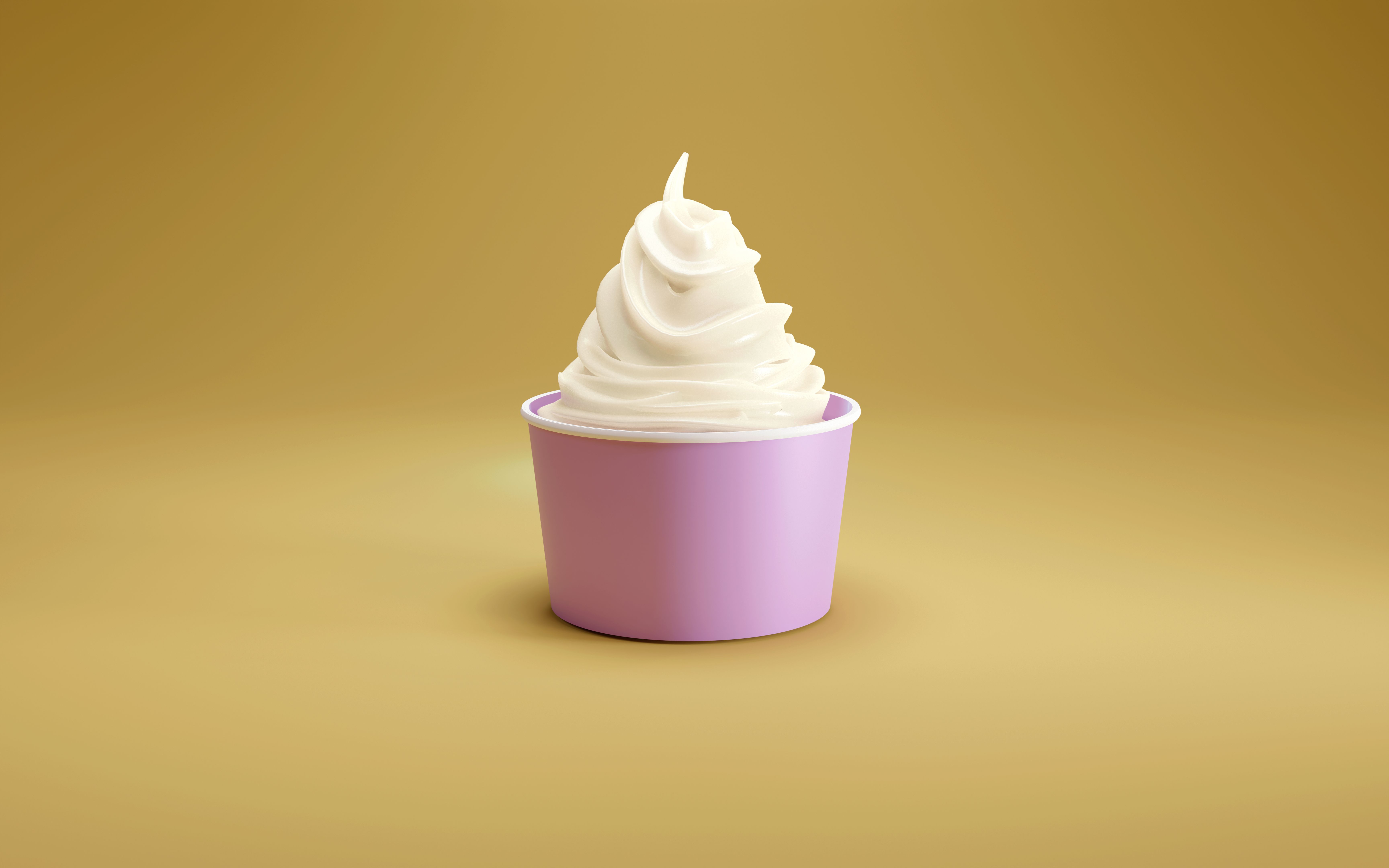 Single soft serve ice cream in a pink cup on yellow studio floor. Single soft serve ice cream in a pink cup on yellow studio floor.