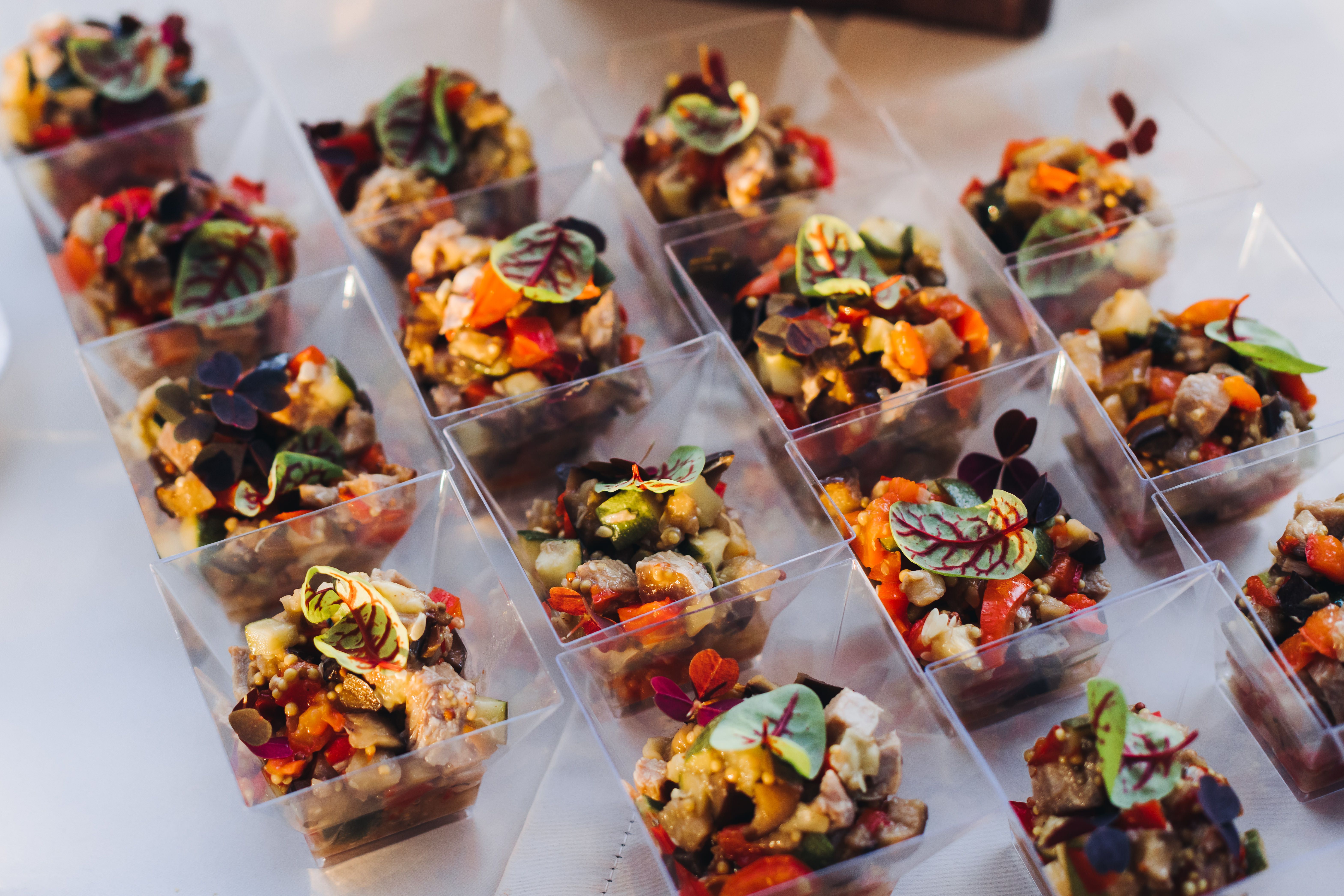 Catering table, beautifully decorated banquet with variety different food snacks appetizers on christmas corporate birthday party event or wedding celebration, canape, salad, delicatessen setting