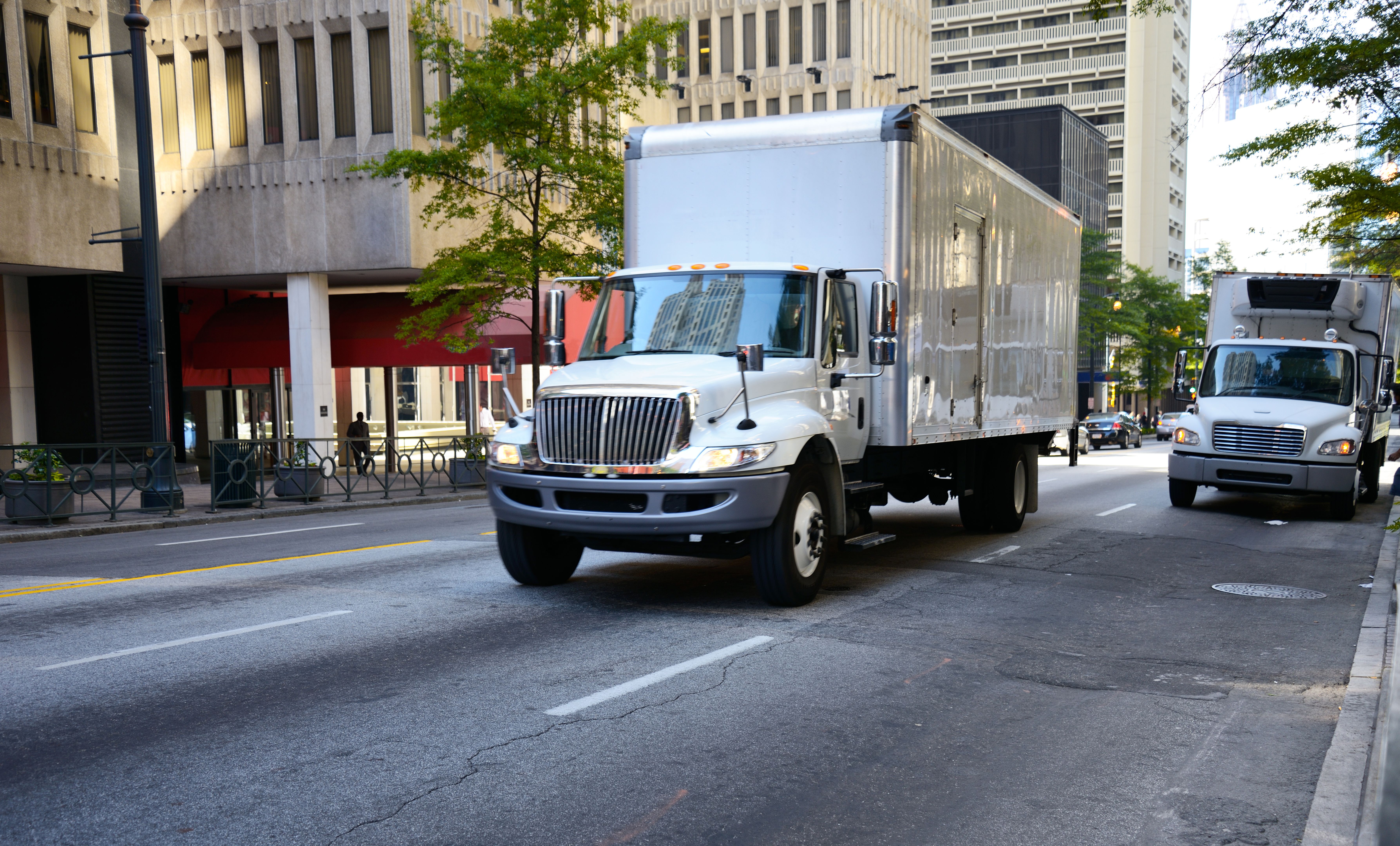 White semi truck driving.