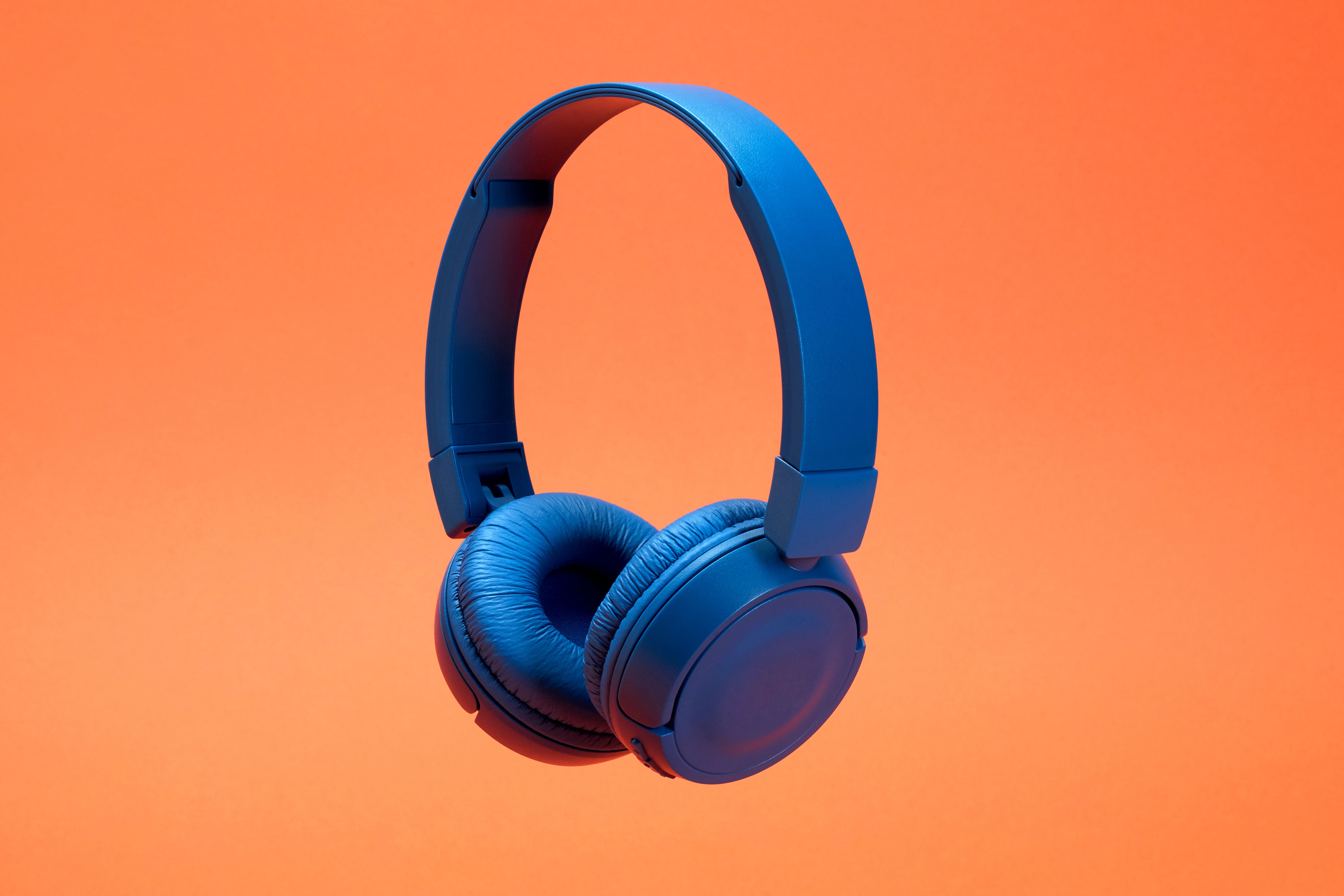 Headphones on the orange color background