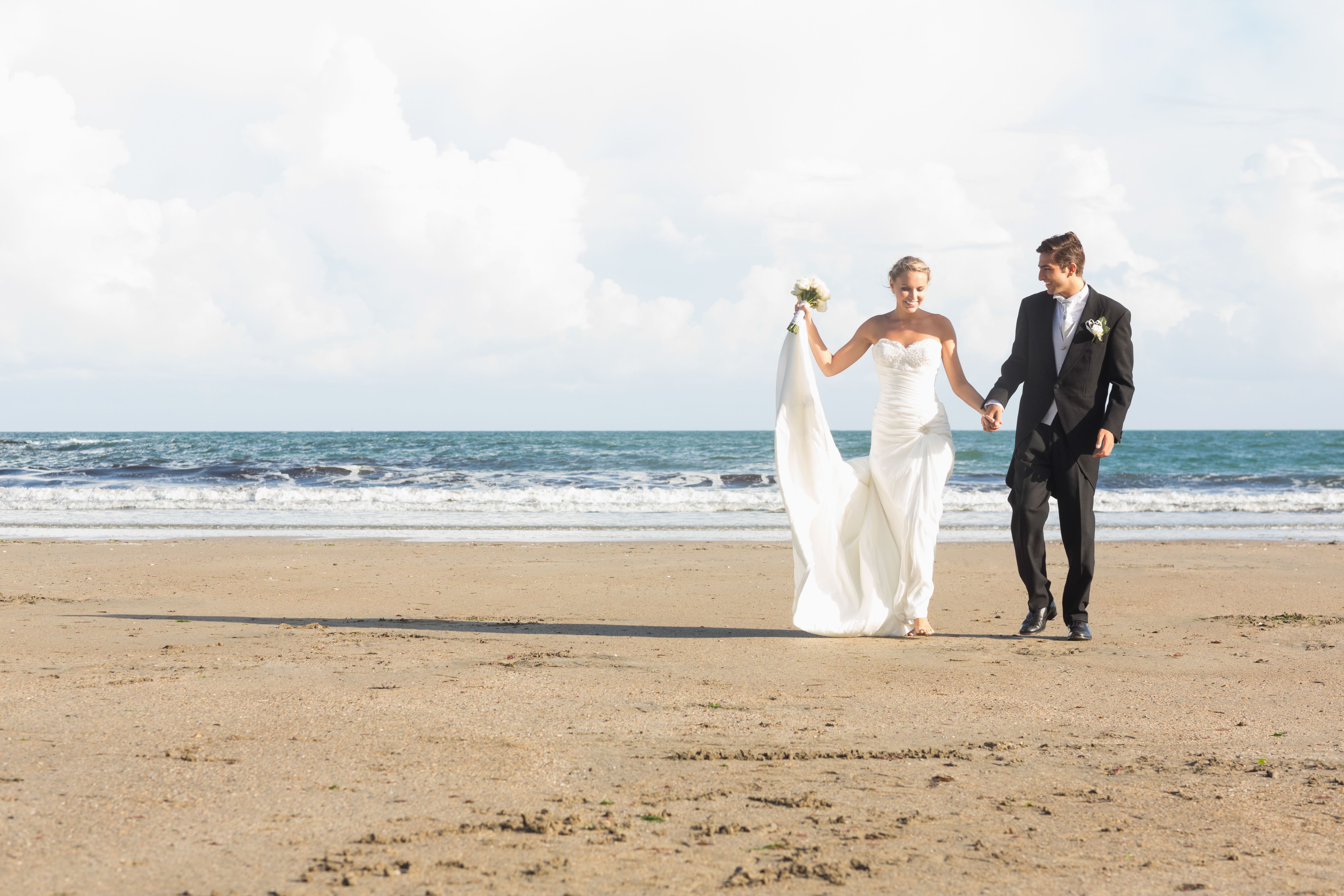 Beautiful lovely young newlyweds walking together