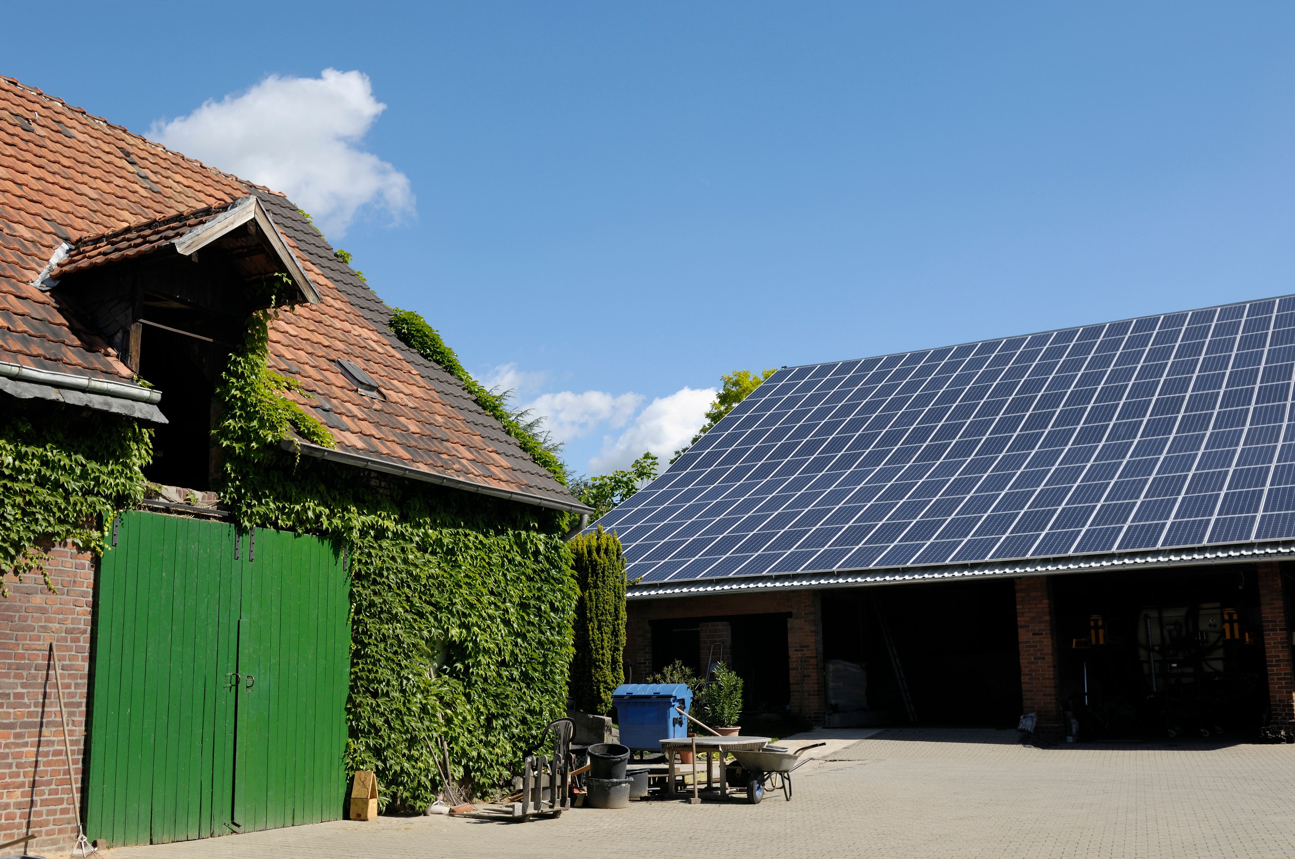 Typical farm buildings one with solar panels on the roof