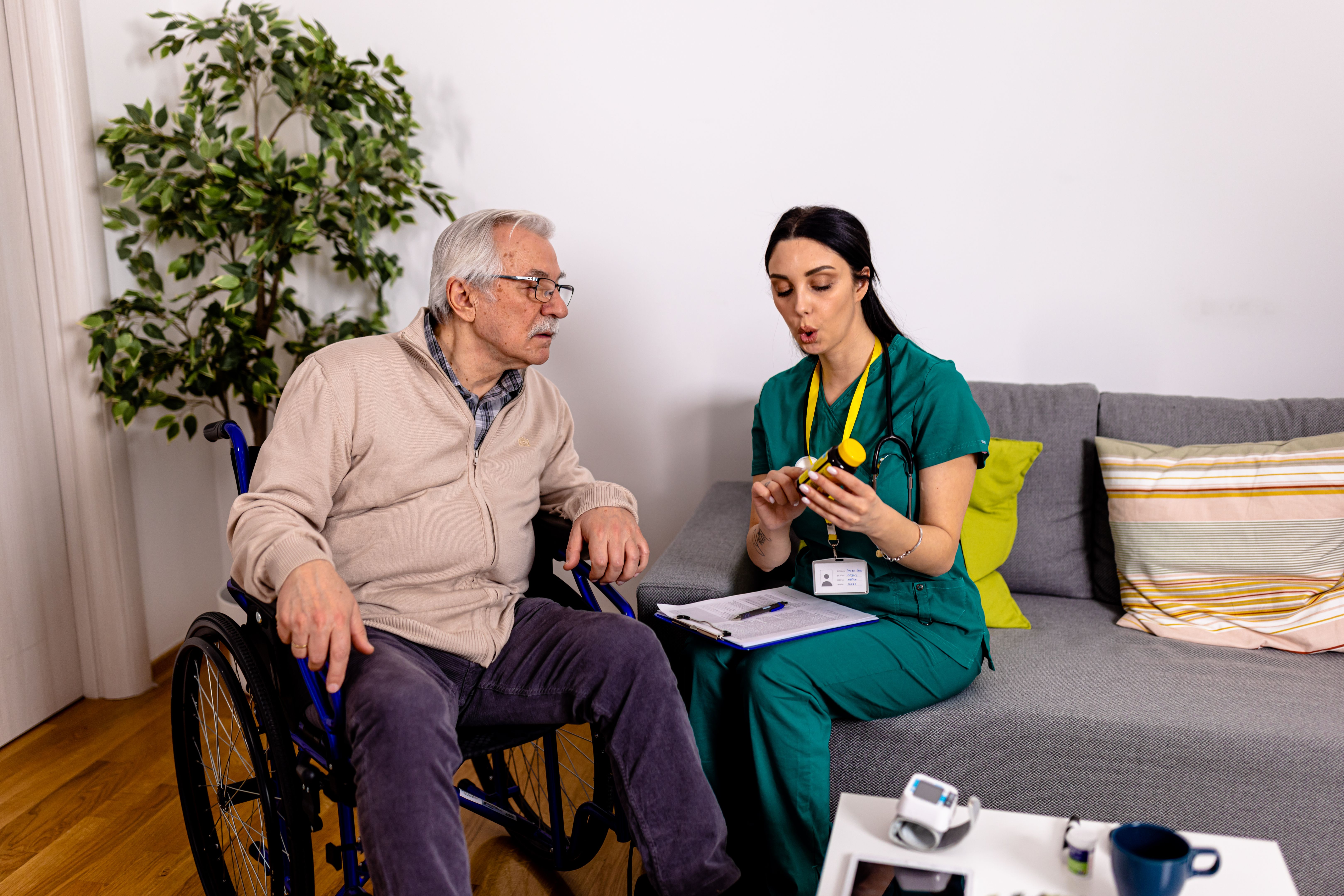 Elderly Man Receives Much-Needed Medication from Caring Volunteer