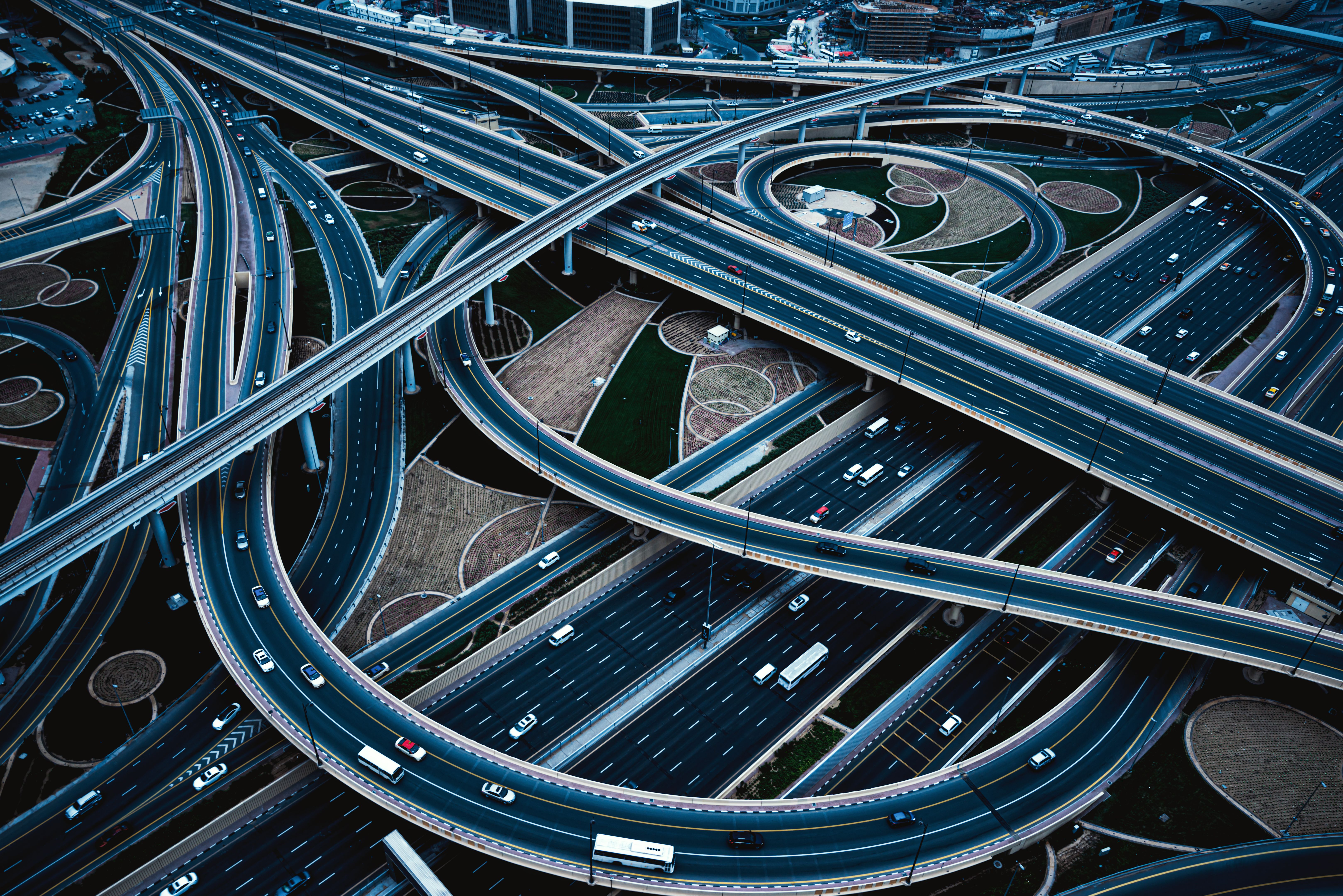 Aerial view of big highway interchange with traffic in Dubai, UAE, at day