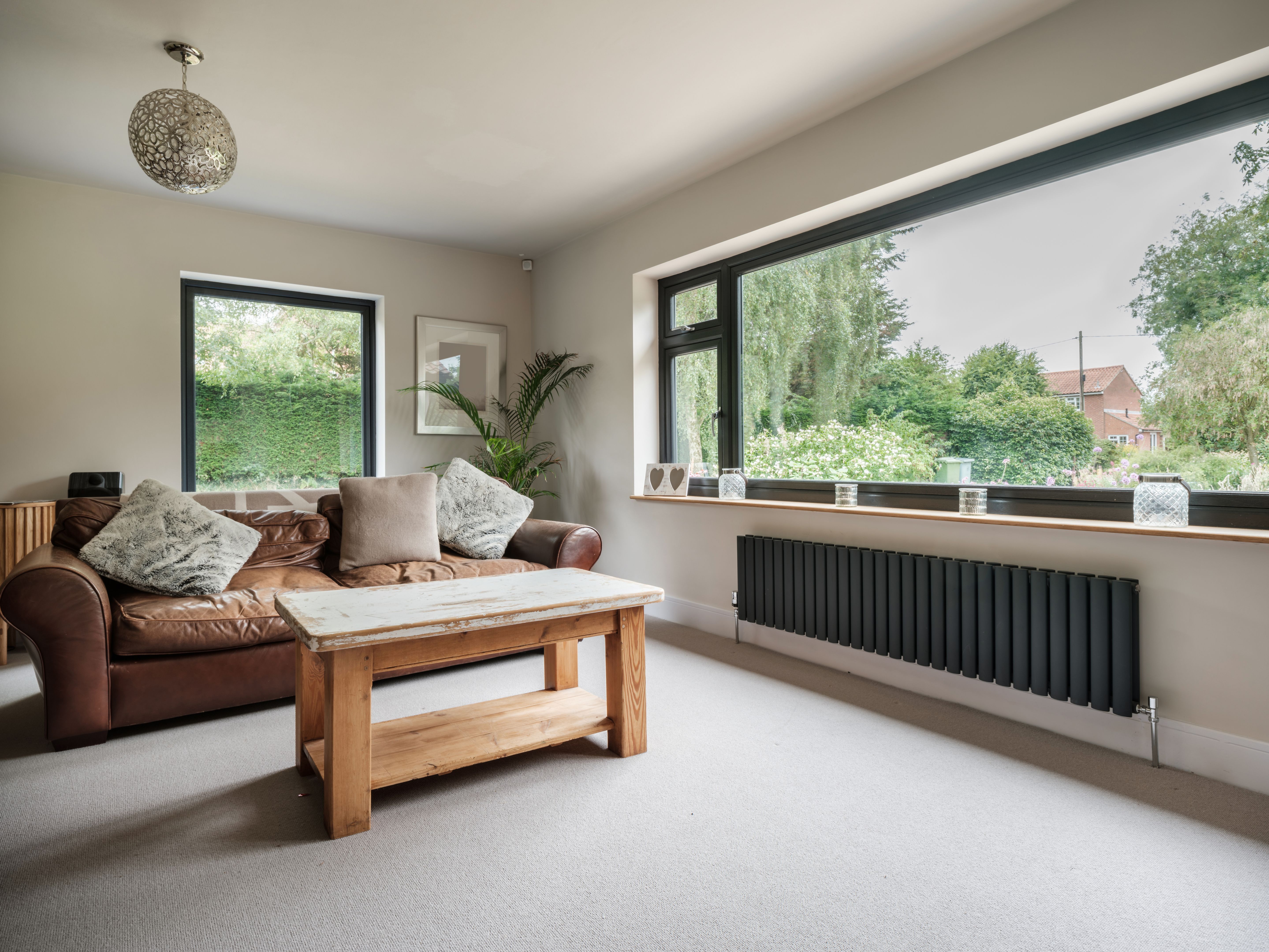 Furnished living room with contemporary radiator