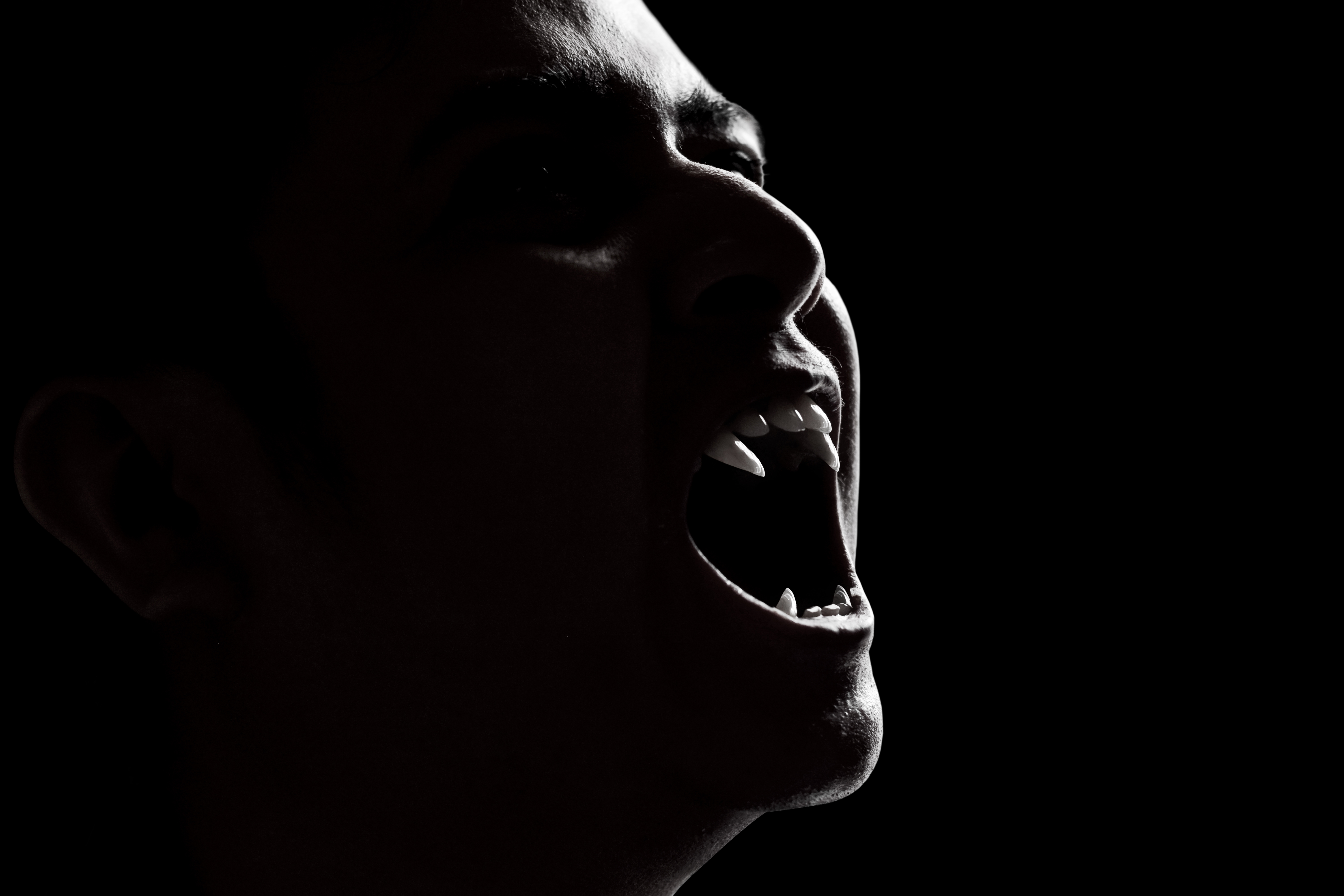 Scary vampire man on dark background