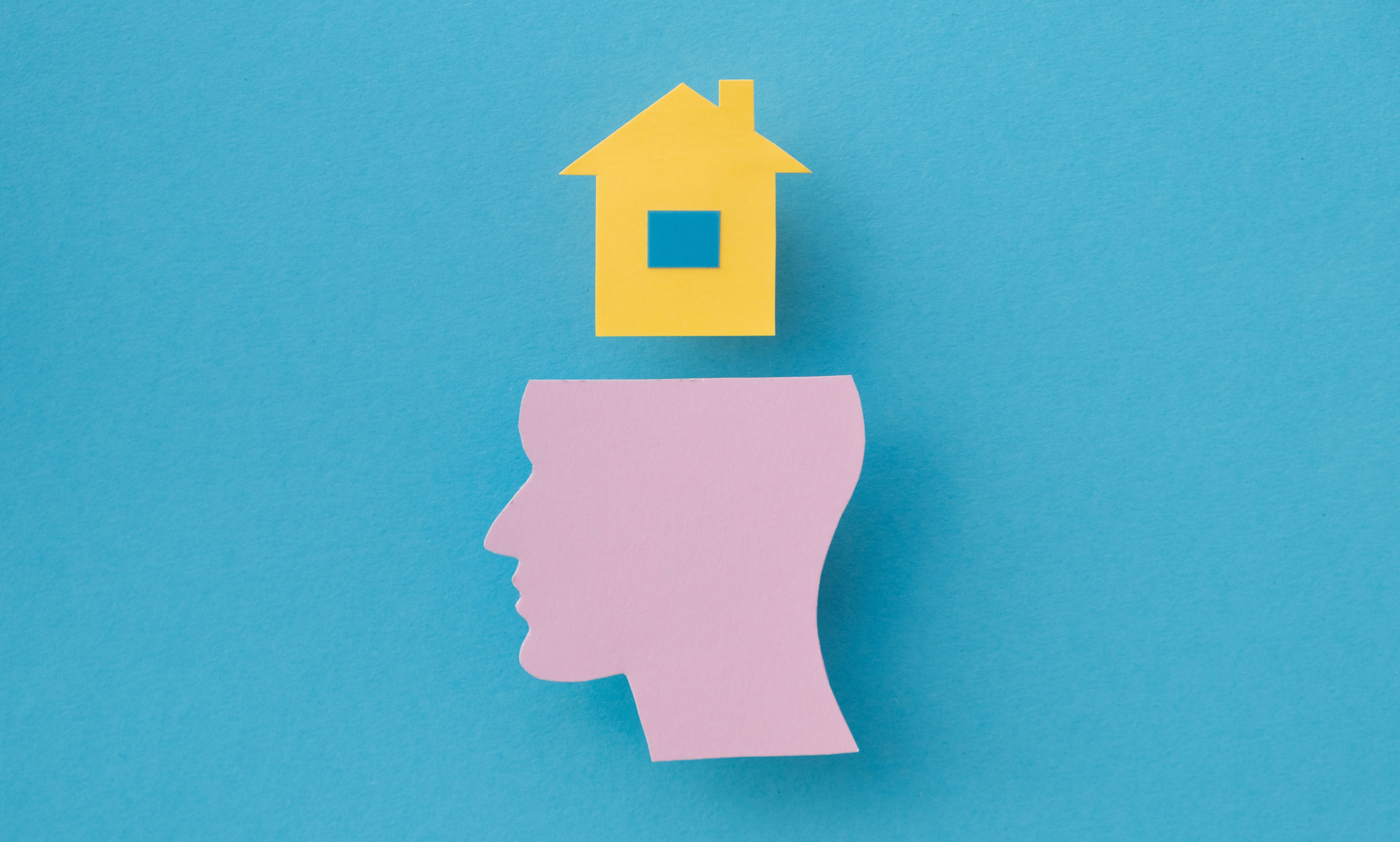 A head with a house on top of it
