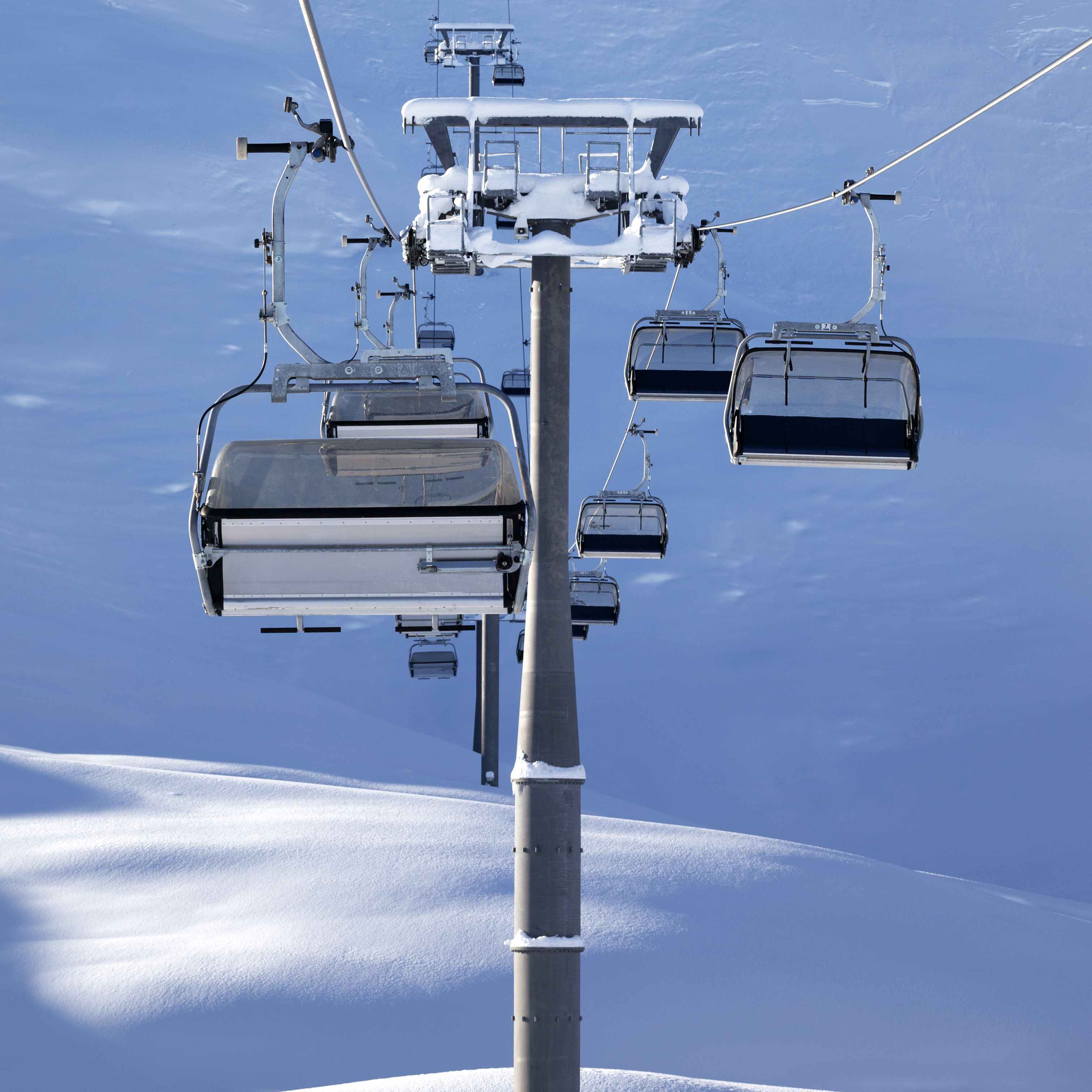 Chair-lift at early morning after snowfall