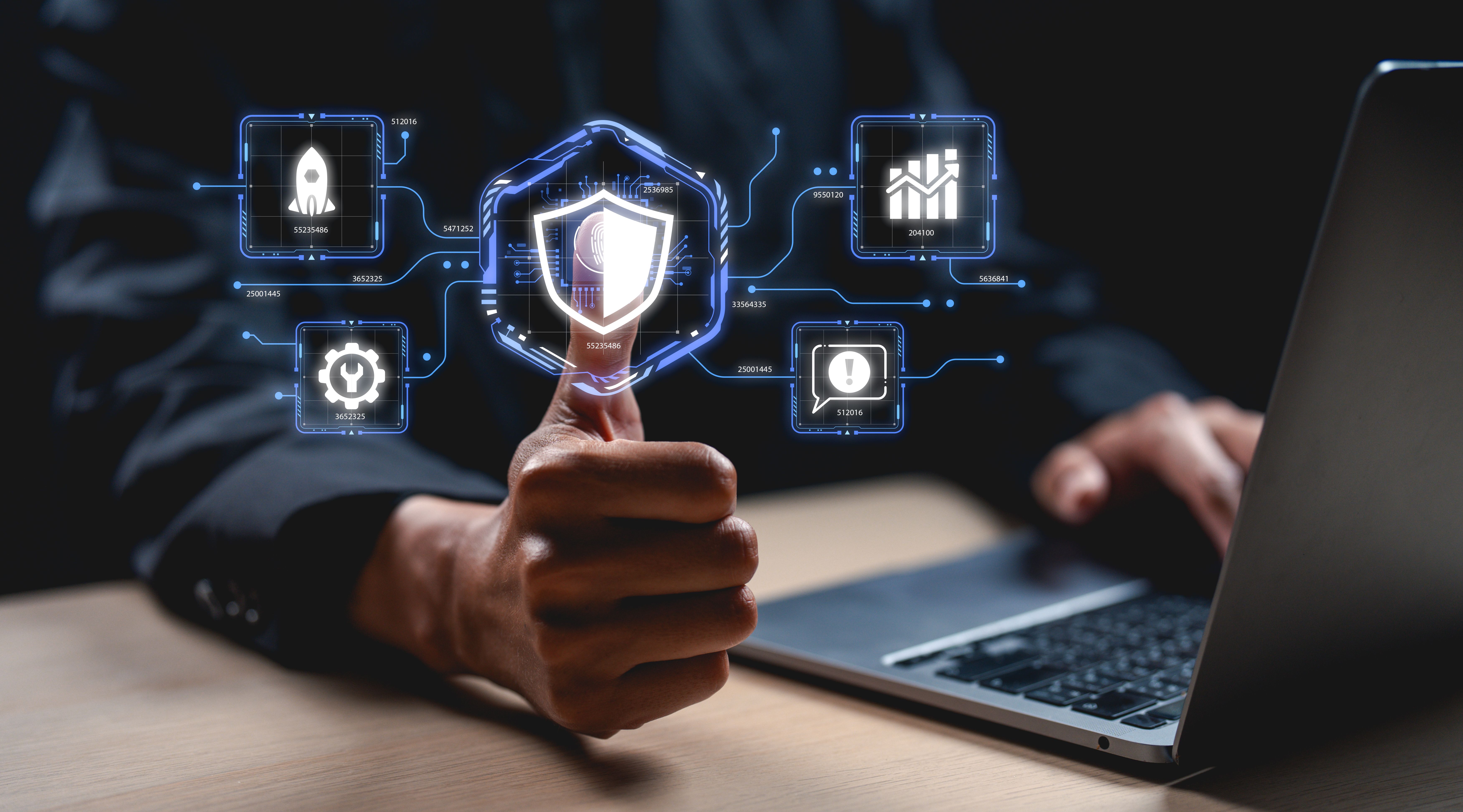 A hand holds a digital shield, surrounded by icons representing cybersecurity metrics, illustrating the intersection of technology and protection.