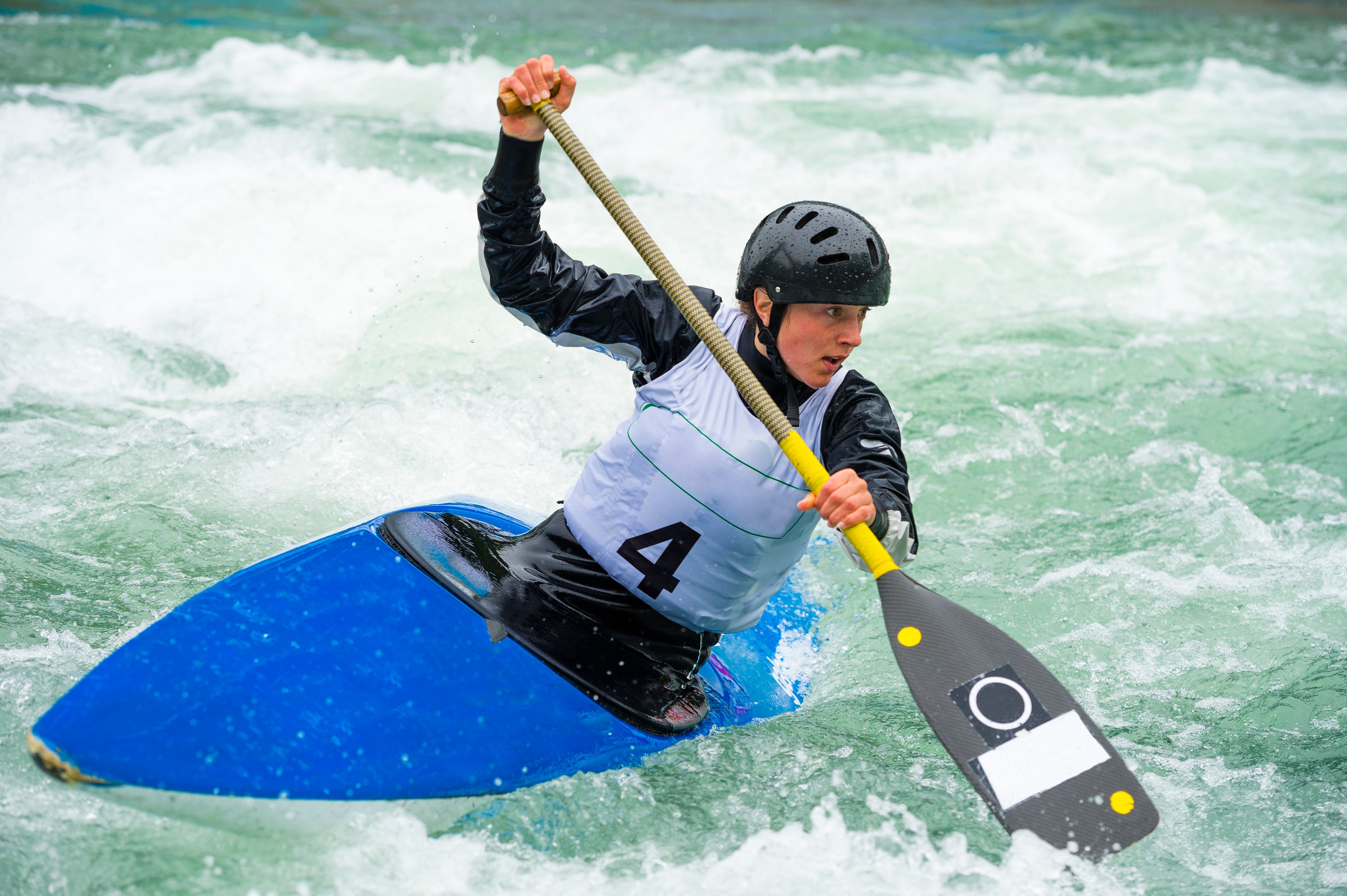 Young Female Canoeist on Wild Water During the Race