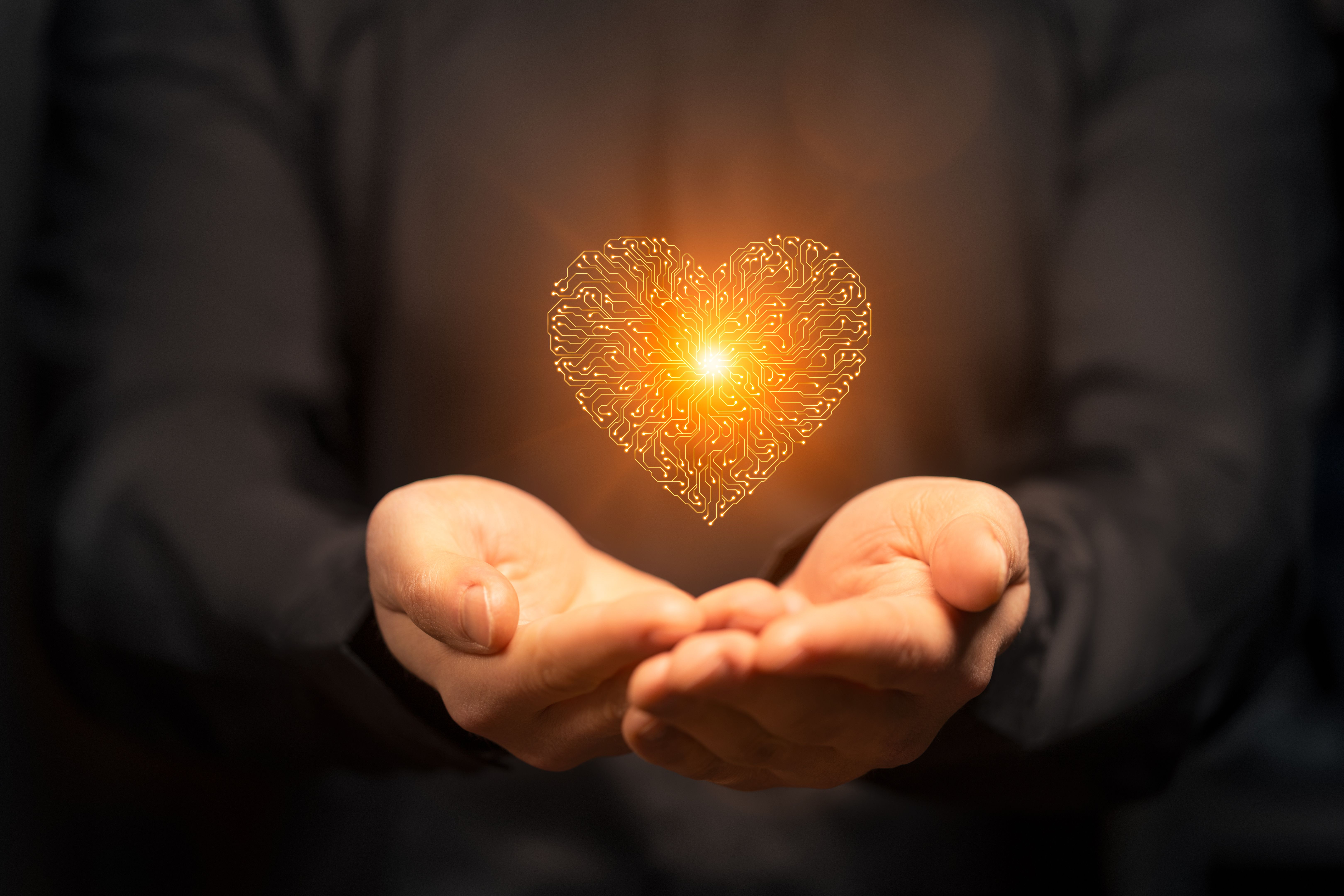Artificial intelligence Circuit board heart symbol in mens hands
