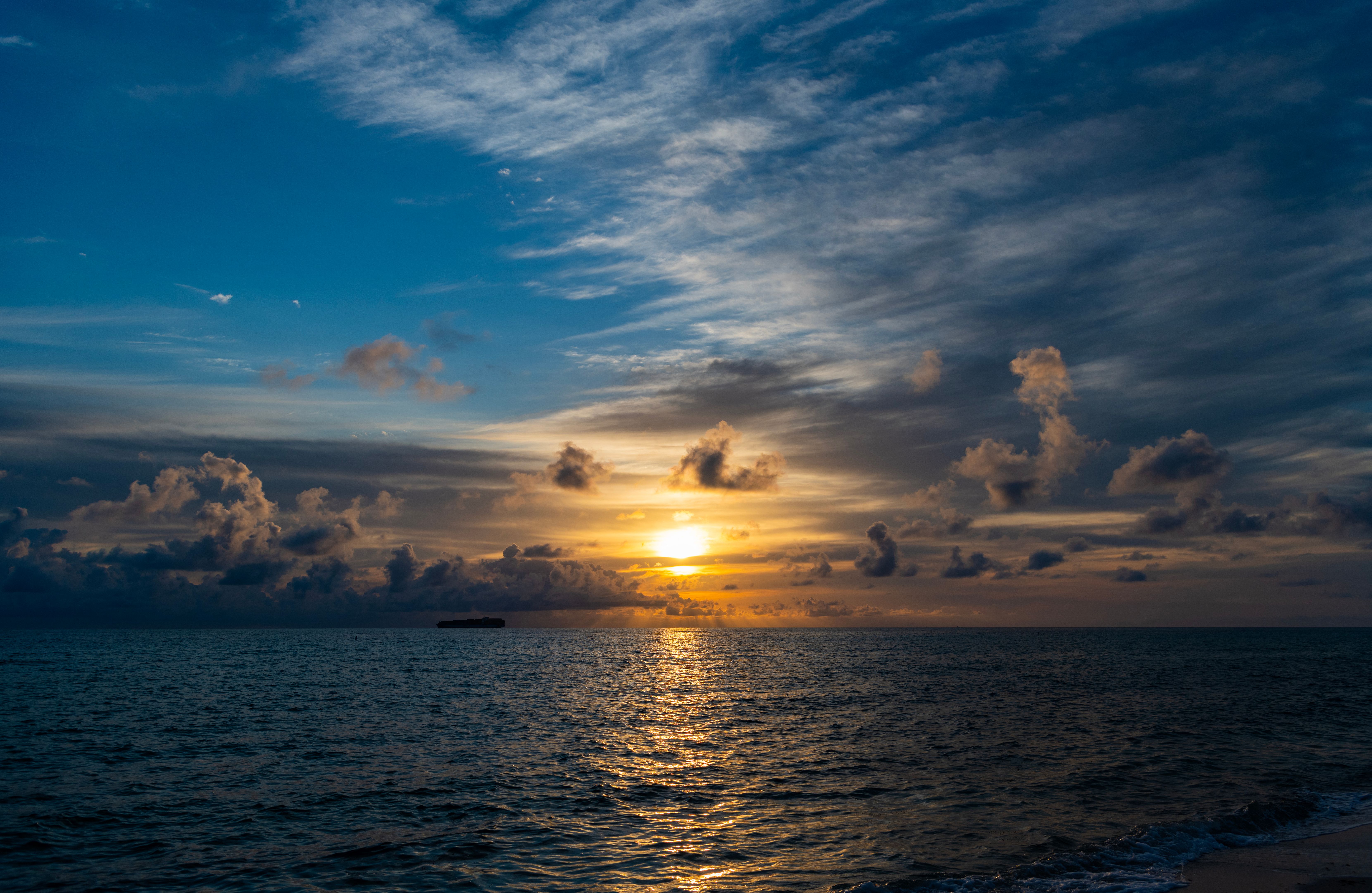 Romantic summer vacation at seascape. Dramatic sunrise. Sea sunrise on summer beach. Sunset seascape at summer vacation. Sunrise with sea beach. Dramatic horizon sea view on sunset. Peaceful sunset