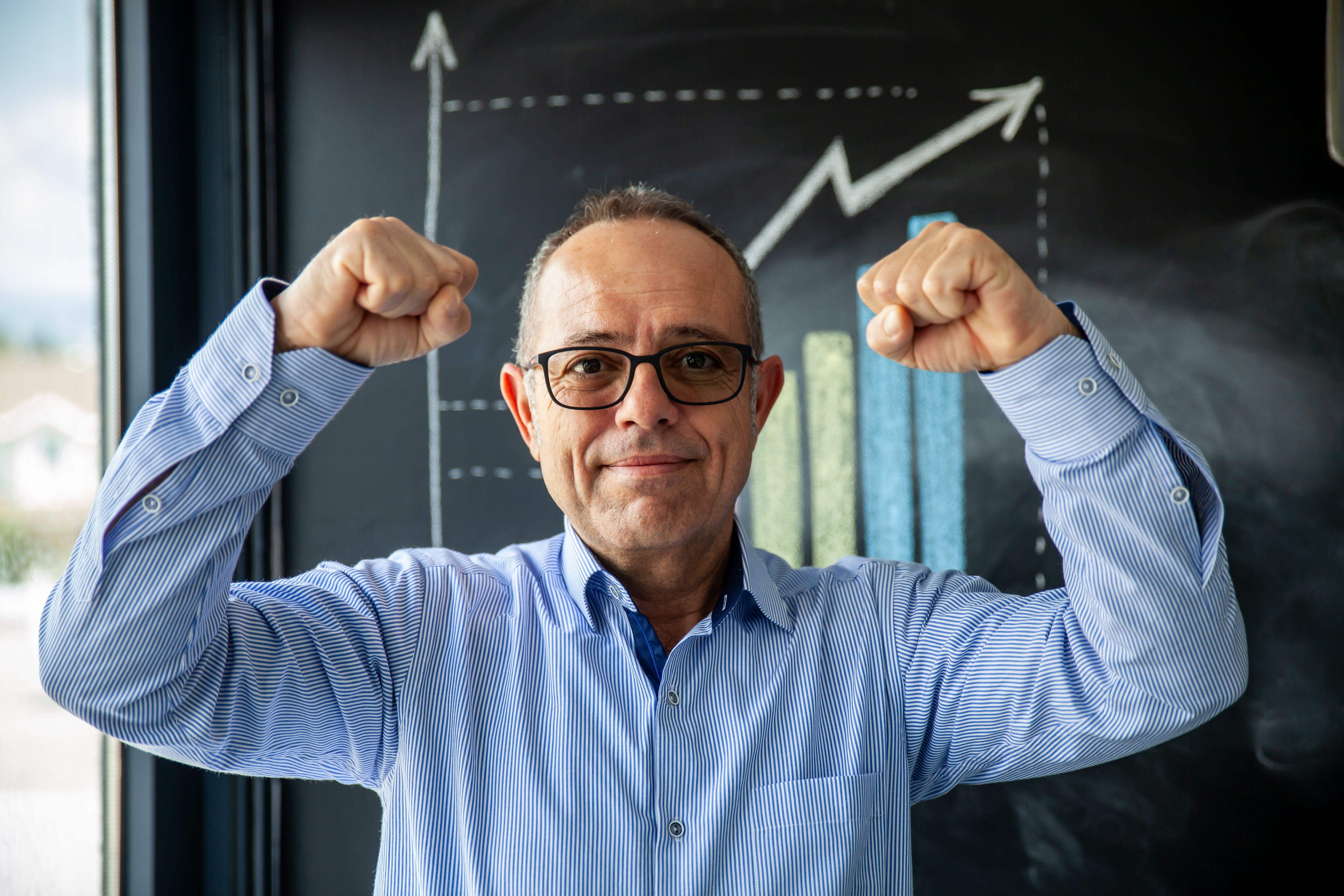 senior businessman hands up and he is doing goal horizontal business still senior businessman hands up and he is doing goal horizontal business still