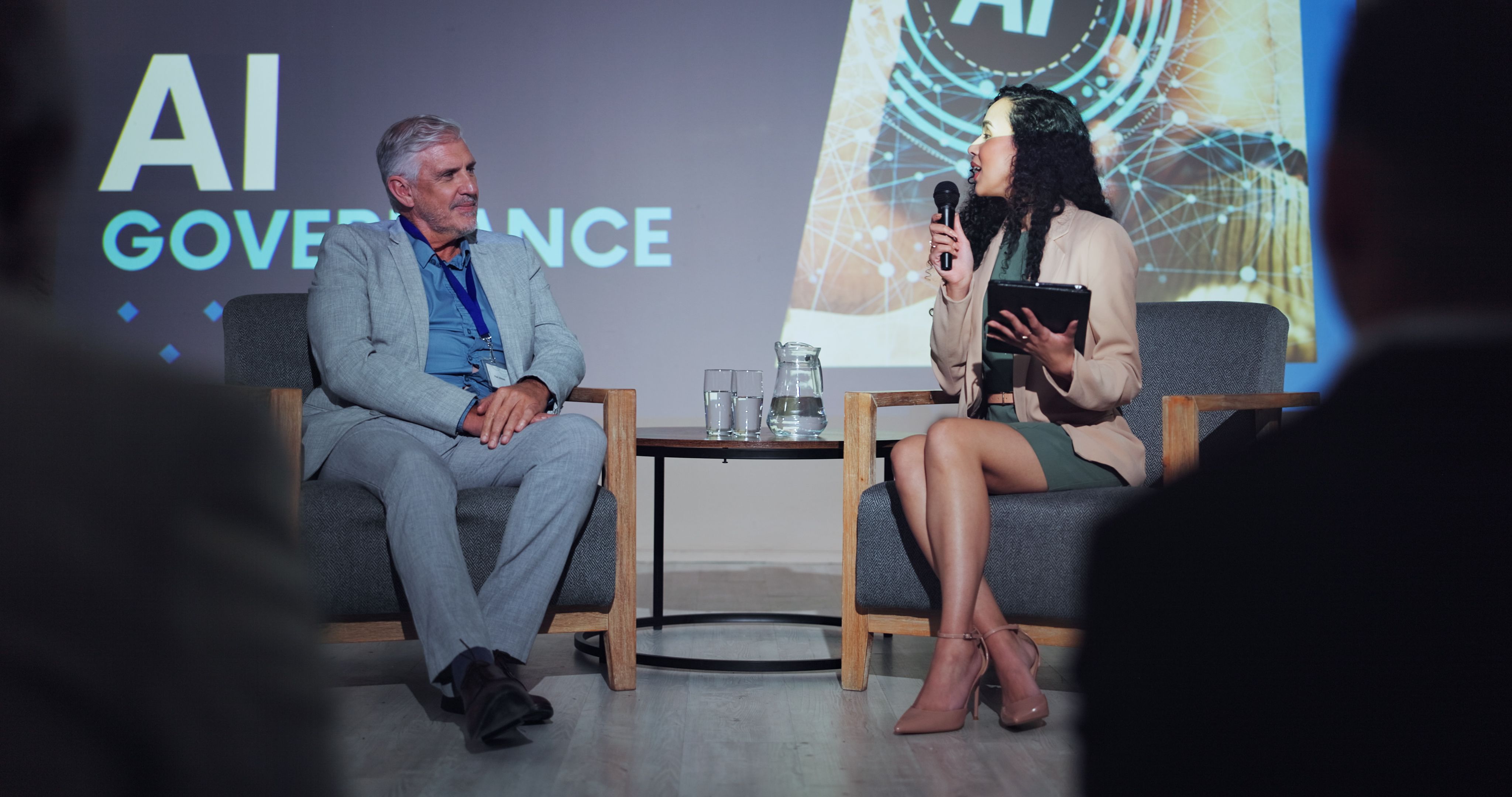 Ai, ethics and interview with business people at seminar for networking, industry panel and keynote speaker. Summit, conference and technology with speech for audience, event showcase and news
