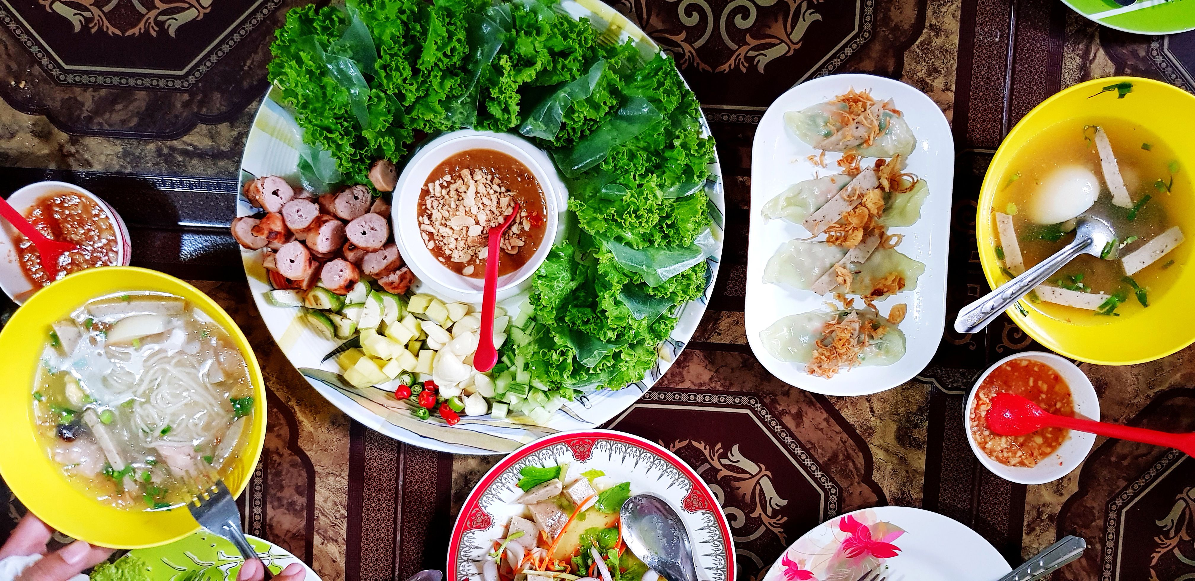 Top view group of Vietnamese food on brown table at Asia restaurant. Healthy eating lifestyle and Flat lay of Asian food