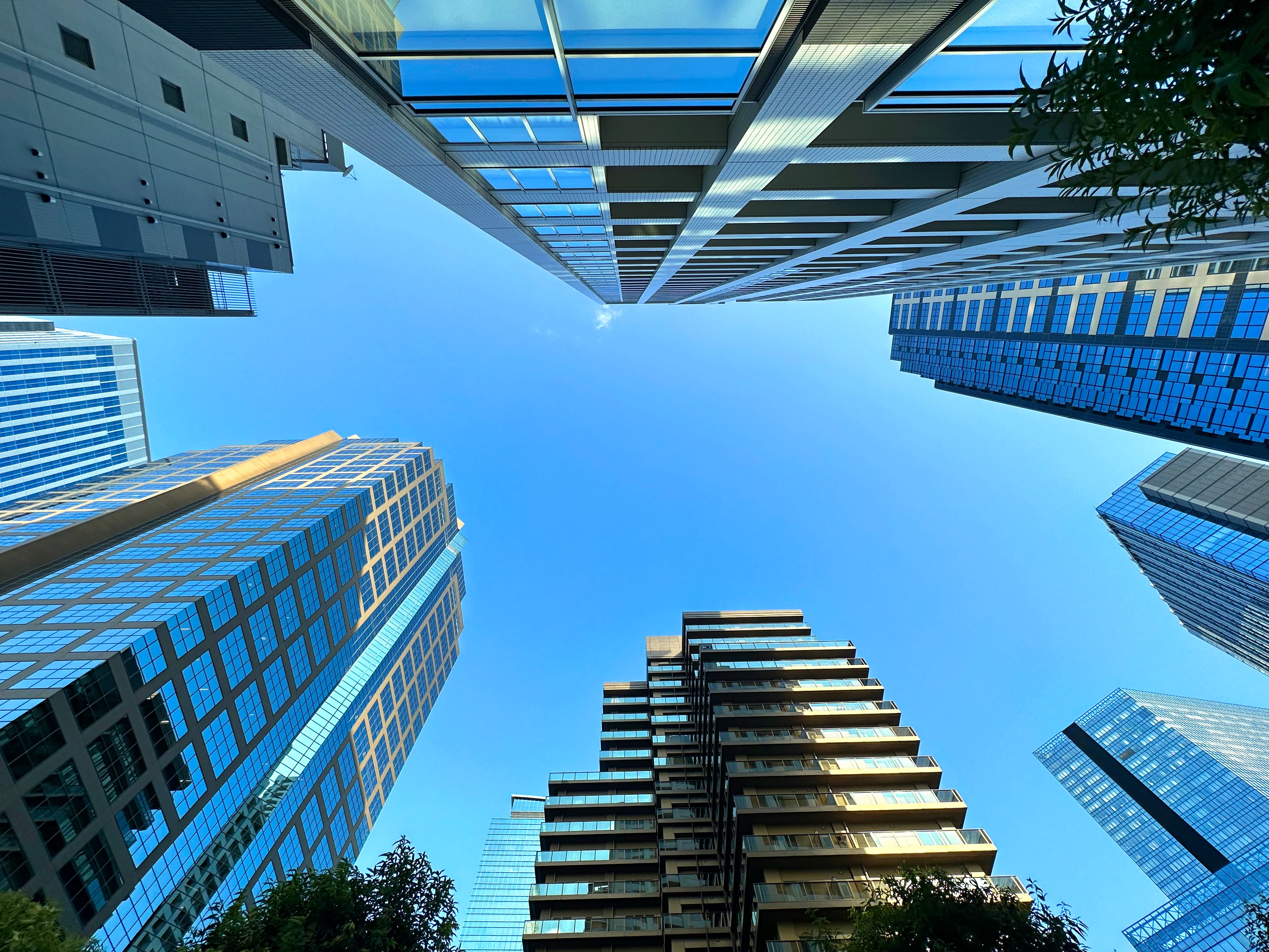 High-rise apartment building in the city and blue sky, daytime, looking up