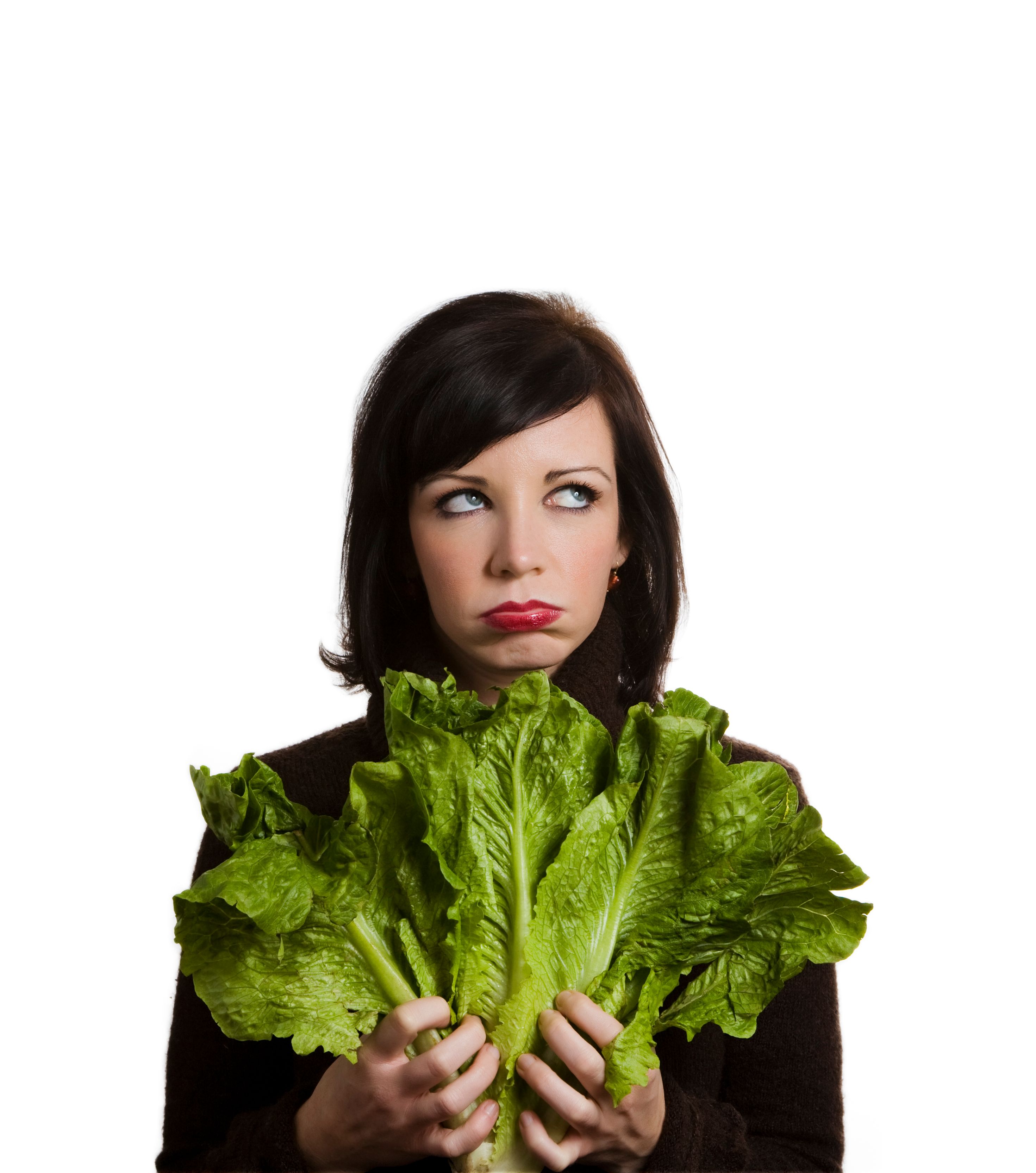 Woman holding lettuce leaves and frustrated face