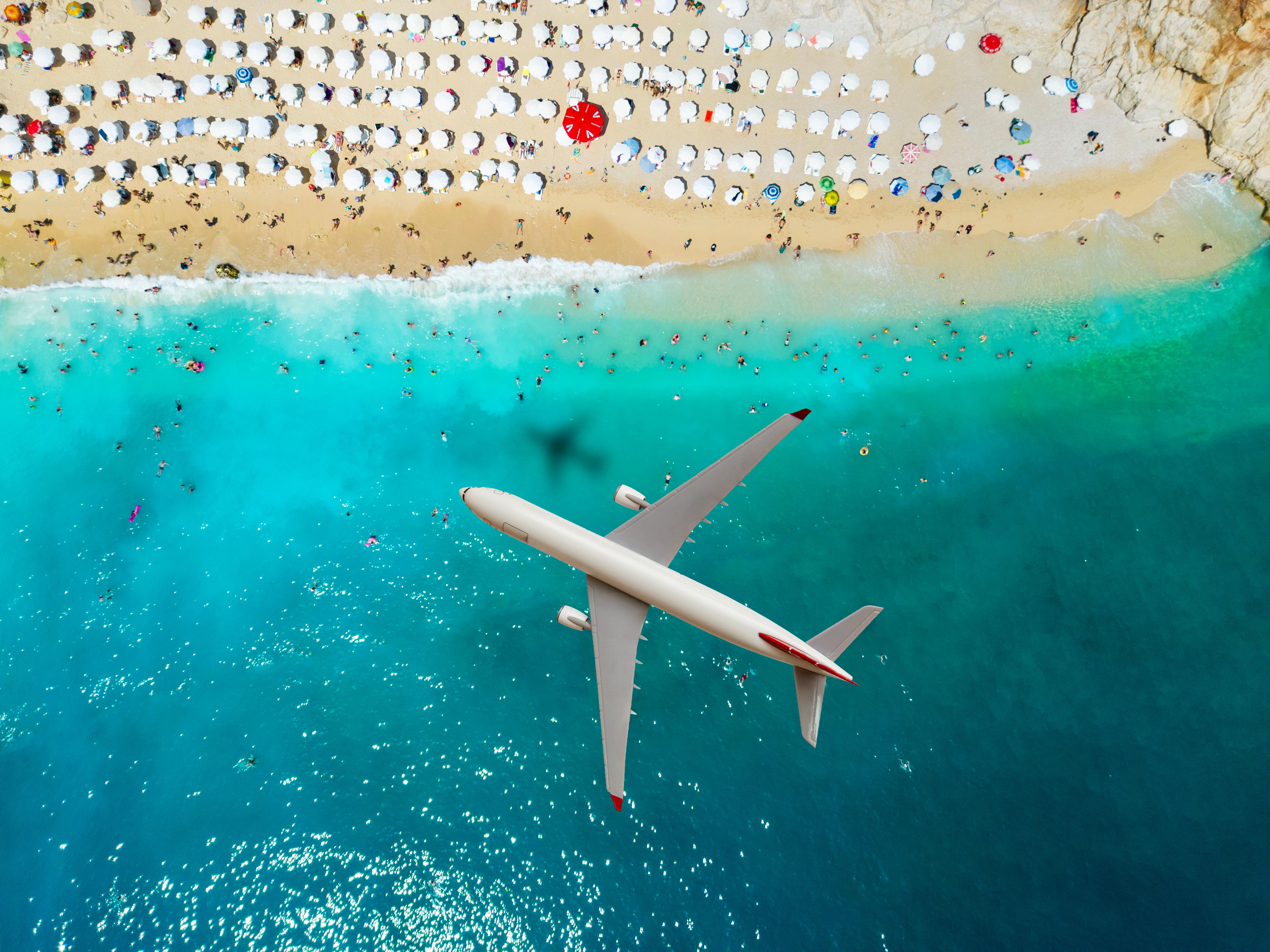 Airplane flying over Kaputas Beach, Antalya, Turkey. Travel concept. Airplane flying over Kaputas Beach, Antalya, Turkey. Travel concept.