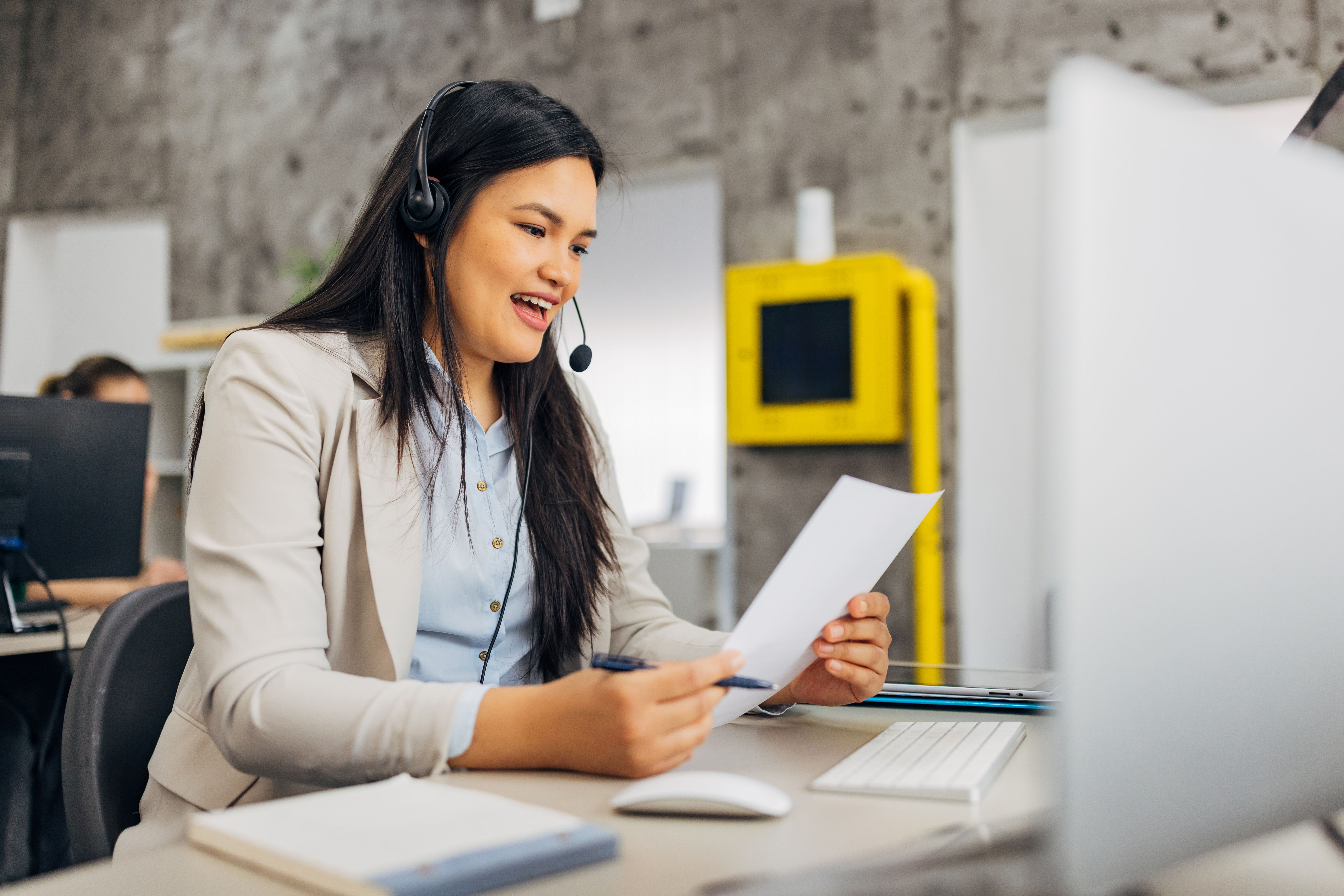 Filipino female customer support representative working in the office